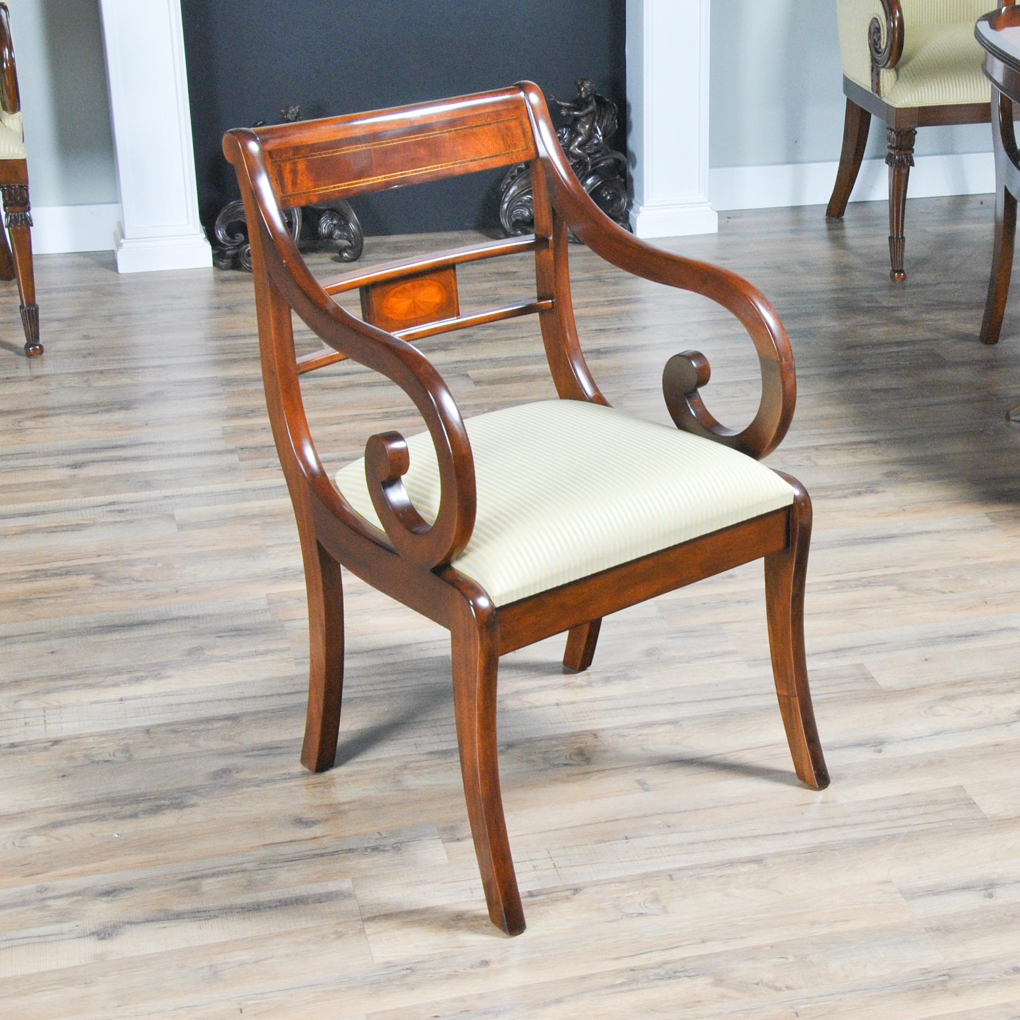 This Set of 10 Banded Mahogany Chairs consists of 2 arm chairs and 8 side chairs. The chairs are created from the finest grade of plantation grown solid mahogany and the finest available veneers. All of these materials come together to create a