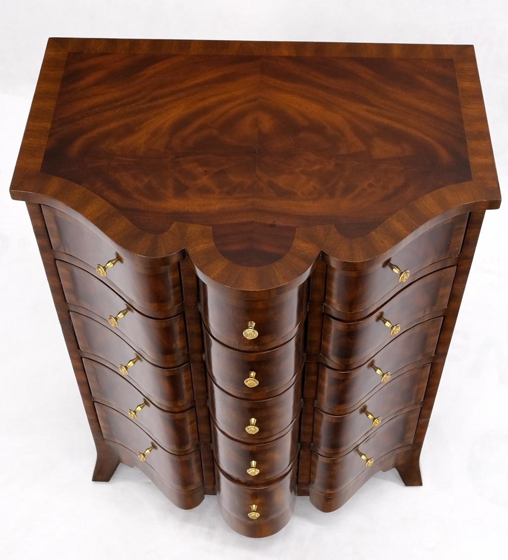Flame mahogany serpentine from banded top and drawers petit dresser bachelor chest.