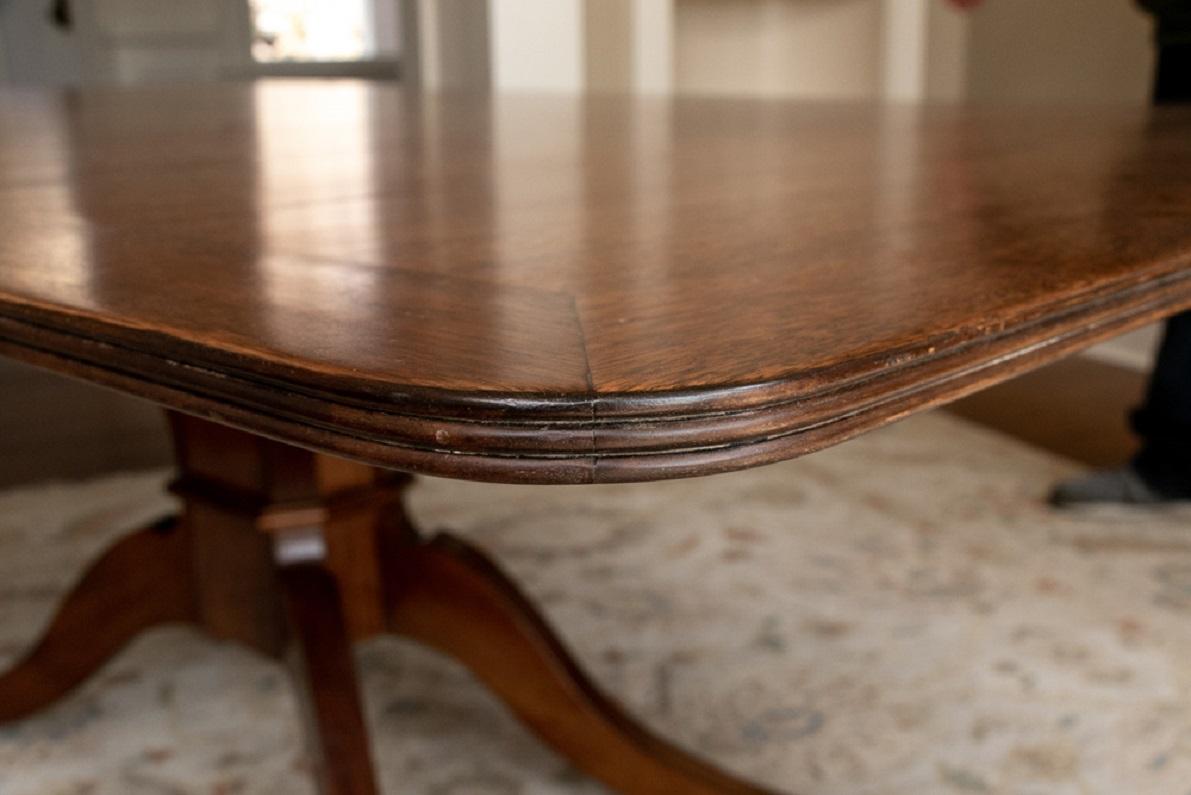 20th Century Banded Walnut Dining Table with Ornate Carved Pedestal Base For Sale