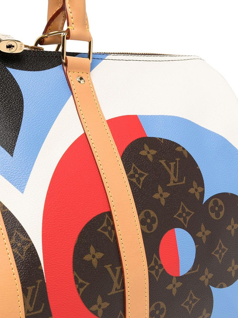 Nicolas Ghesquière reinterprets Monogram canvas to create this eye-catching Game On Keepall Bandoulière 45 duffle bag for Cruise 2021. Here, the monogrammed Luis Vuitton and blossoms are combined with vibrant prints of a pack of playing cards