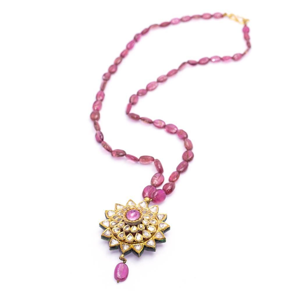 Exceptional Diamond Necklace, reversible with floral motif in fire enamel  40,92 grams  40x Fantasia cut Diamonds weighing approx. 4,50ct  1x Pink Tourmaline weighing approx. 1,00ct  Solid  Oval shaped chain of natural Tourmalines, length 40cm 