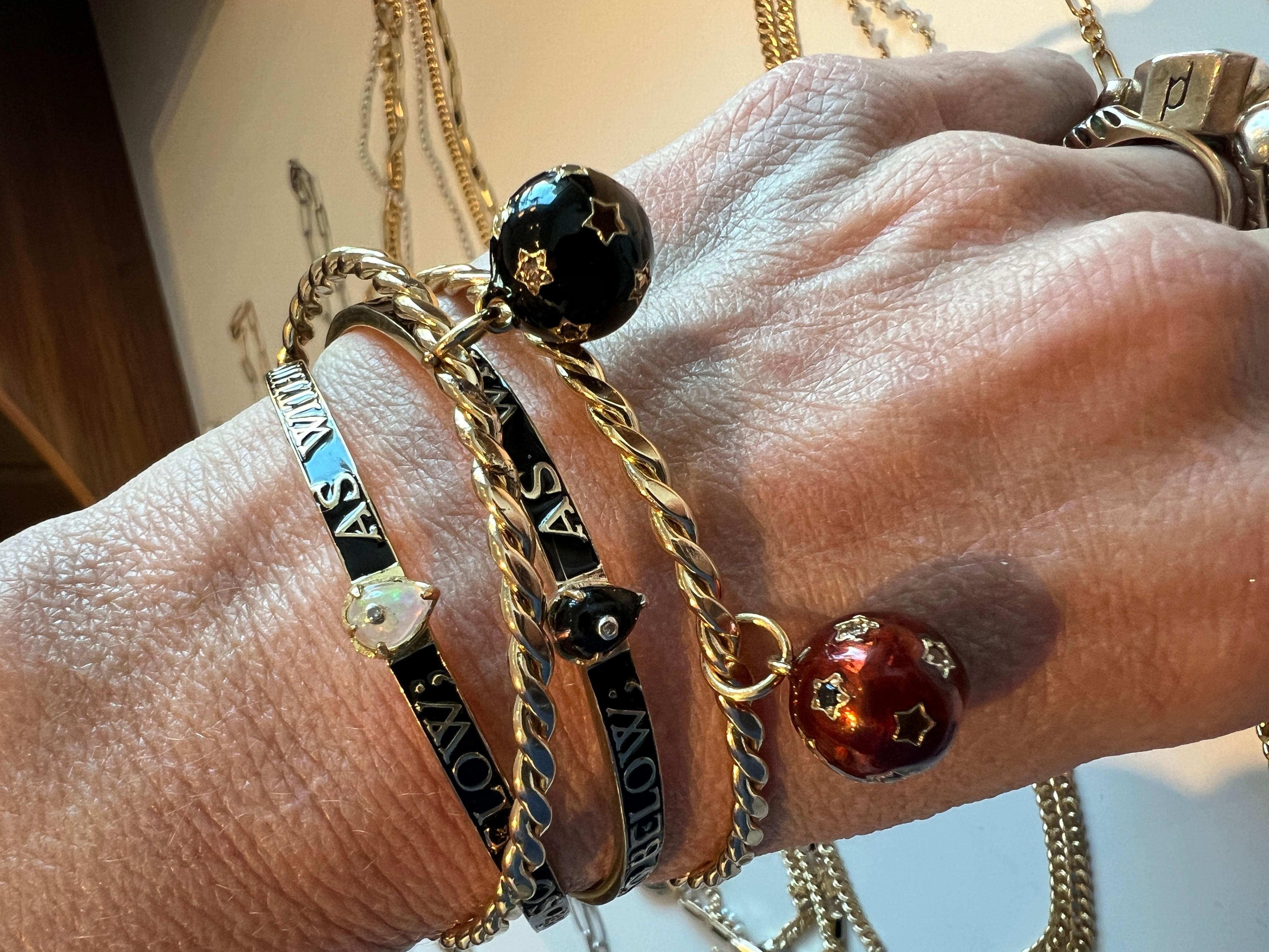 Bangle Black Enamel Emerald Diamond 

Heart Emerald Diamond Bangle Bracelet Black Enamel Victorian Style Hermetica  

Inspired by Hermetica and Cabbalistic concepts of the micro and macro cosmos. 

Gold plated Brass with Black Enamel

Designer J