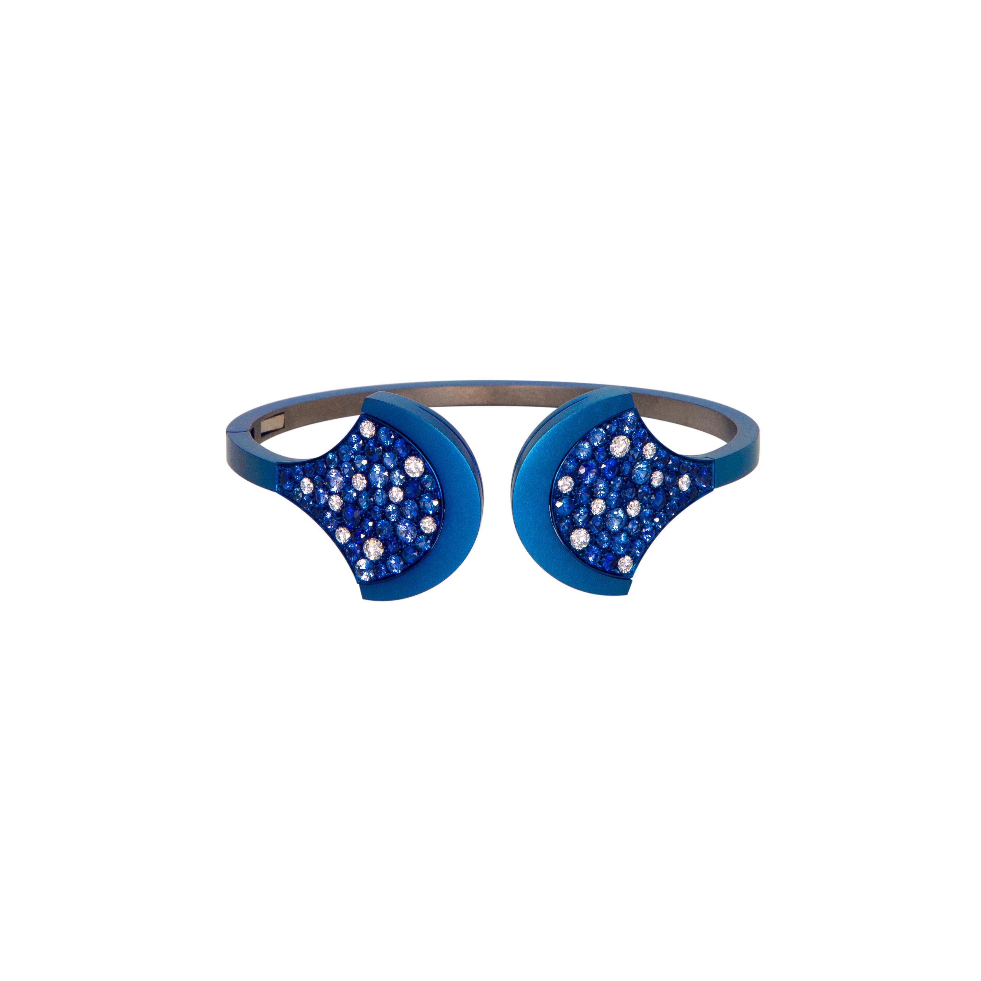 Bangle Blue Titatium with Diamonds and Blue Sapphire.
Luxury Jewel for your Own Collection.
Unique Bangle Manufactured in Titanium Extra Light with Diamonds ct. 0.75 (n.18 stones) and Blue Sapphire ct. 4.56 (n.86 stones). Titanium is around 11.30