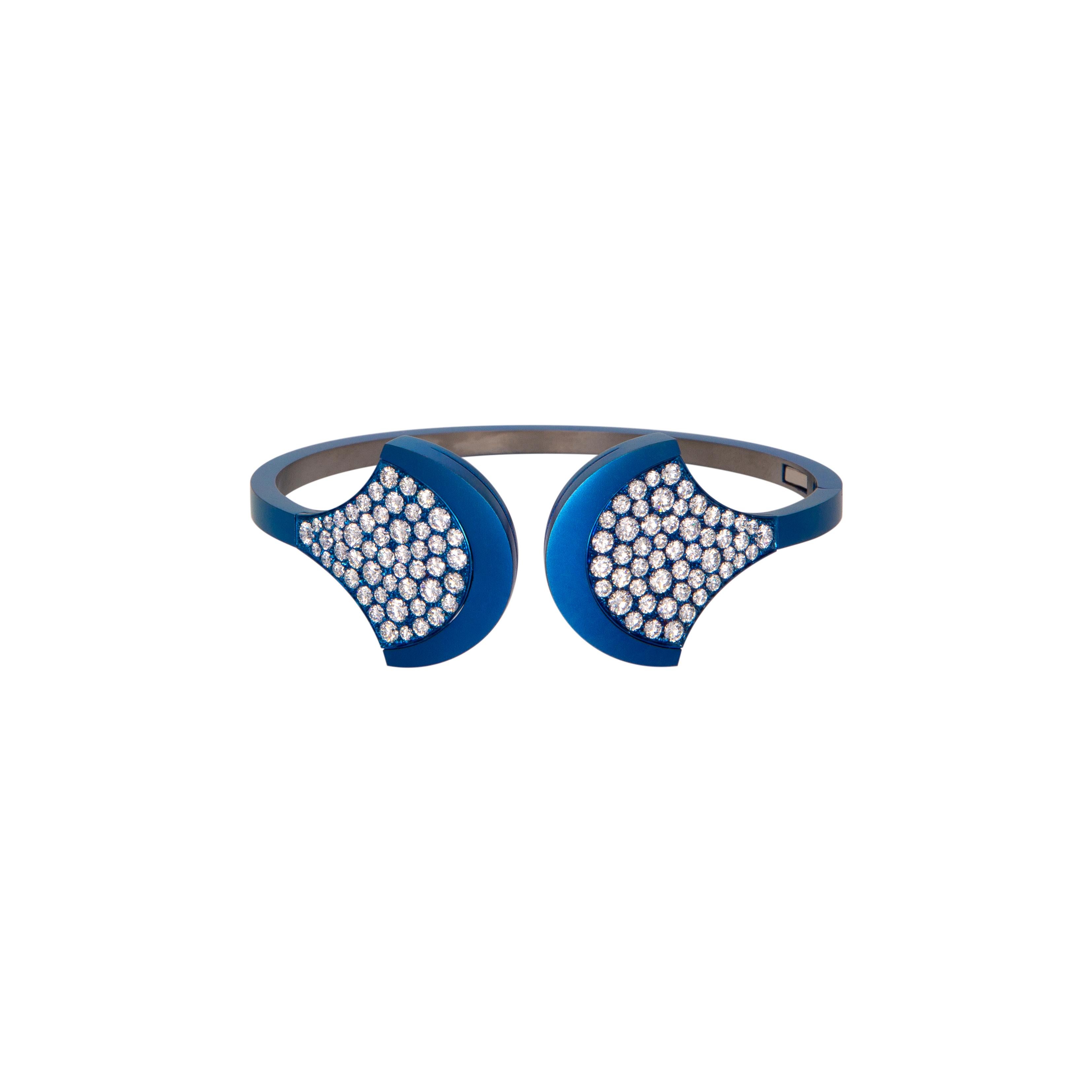 Bangle Blue Titatium with Diamonds.
Extra Jewel for your Own Collection.
Unique Bangle Manufactured in Titanium Extra Light with Diamonds ct. 4.09 (n.104 stones). Titanium is around 11.30 grams. 
Angeletti Boasts an Exceptional History Made of Pure