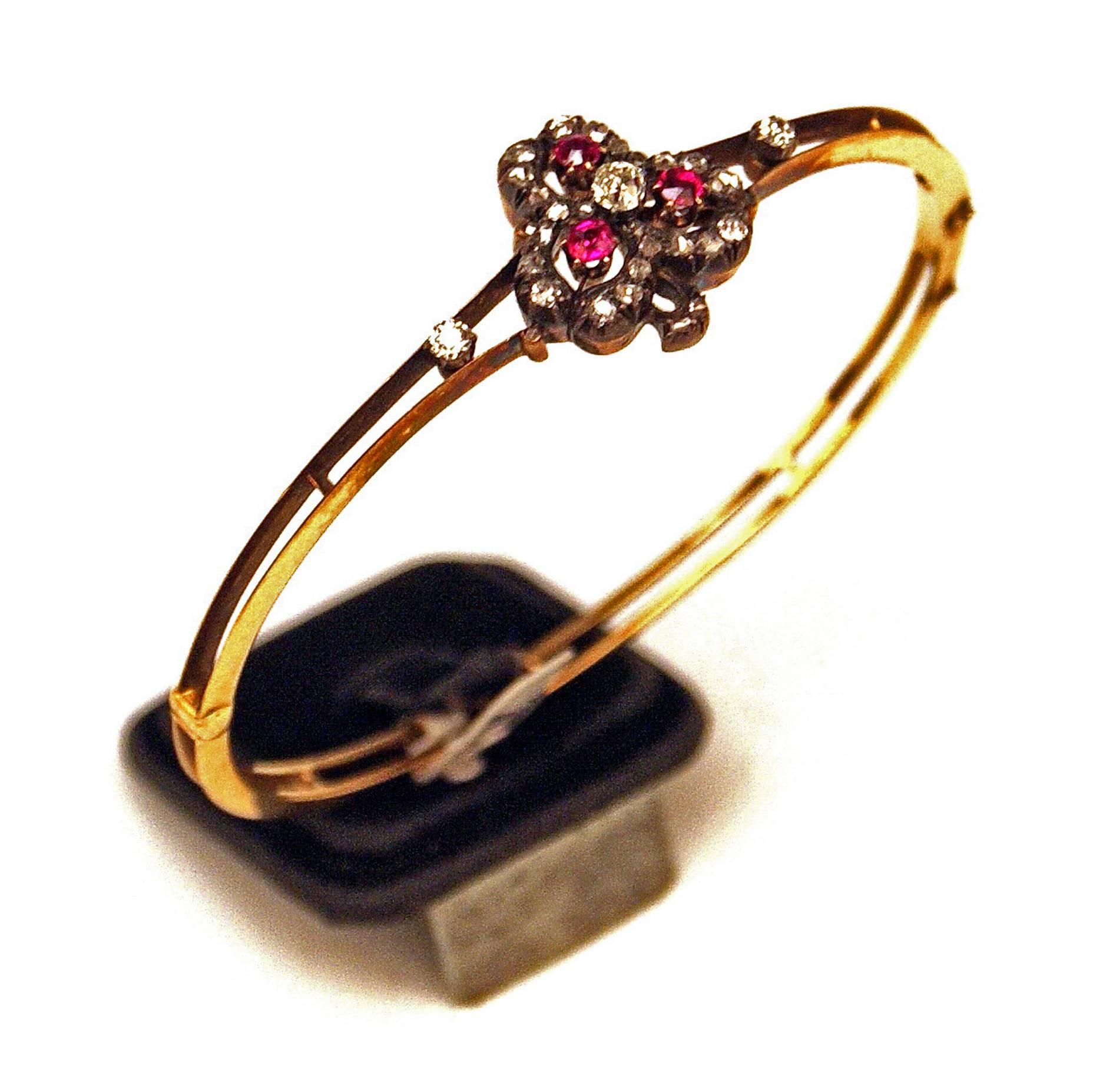 STUNNING ART NOUVEAU VIENNESE (AUSTRIAN) GOLDEN BANGLE / BRACELET, COVERED WITH:
1)  MANY OLD-CUT BRILLIANTS HAVING WEIGHT OF 1.10 CARATS IN TOTAL
2)  THREE EXCELLENTLY CUT RUBIES

This bangle is stunningly decorated with mentioned valuable
