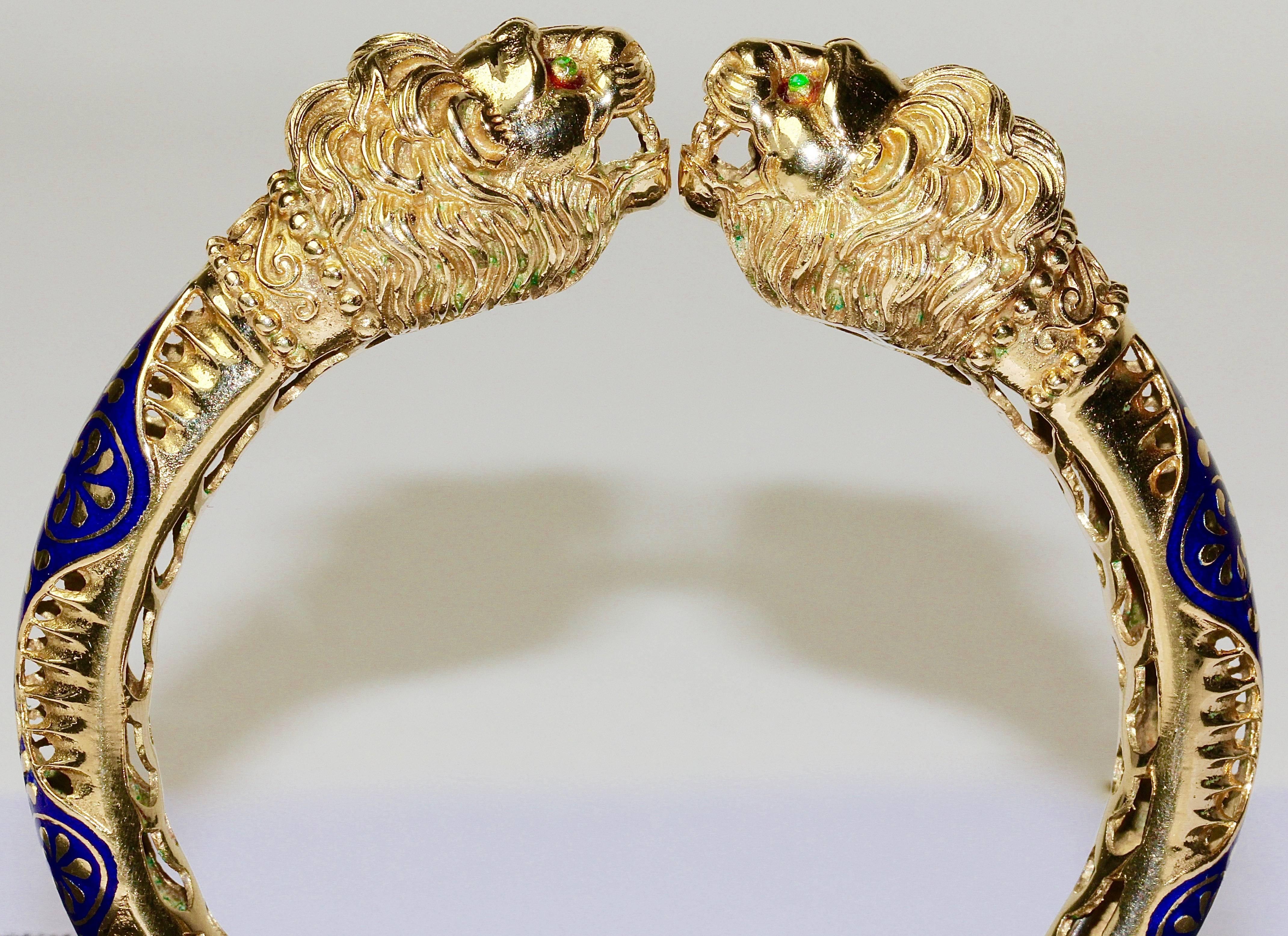 High quality bangle. 18k gold, finest goldsmith and enemal work. 
Set with four small emeralds (as lion eyes).
In the style of Ilias Lalaounis.

In two places slight flaking of the enamel.
Hallmarked.