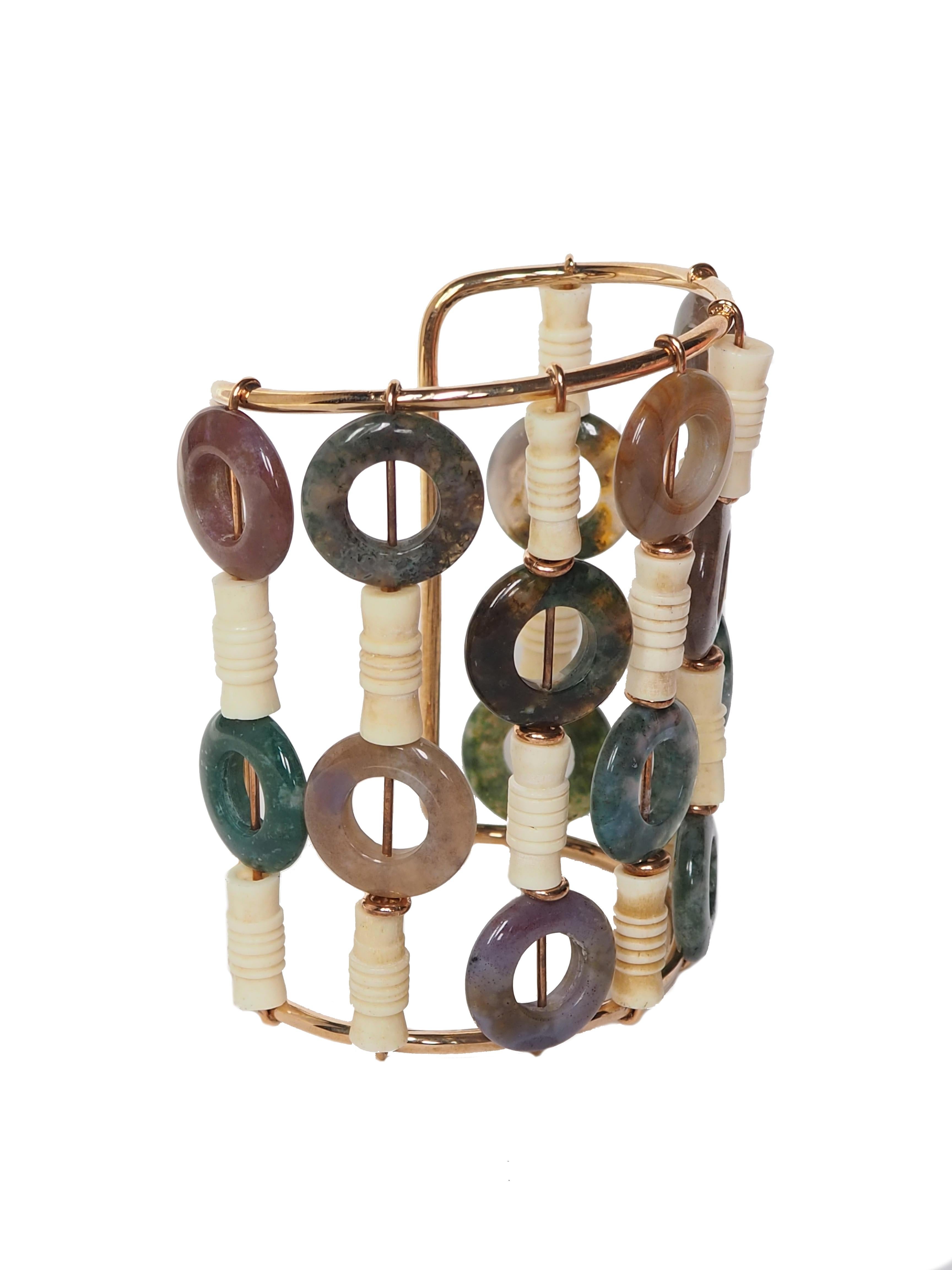 Very nice big bangle with jasper and Carved bone elements bronze linked. Hight cm 8,5.
All Giulia Colussi jewelry is new and has never been previously owned or worn. Each item will arrive at your door beautifully gift wrapped in our boxes, put