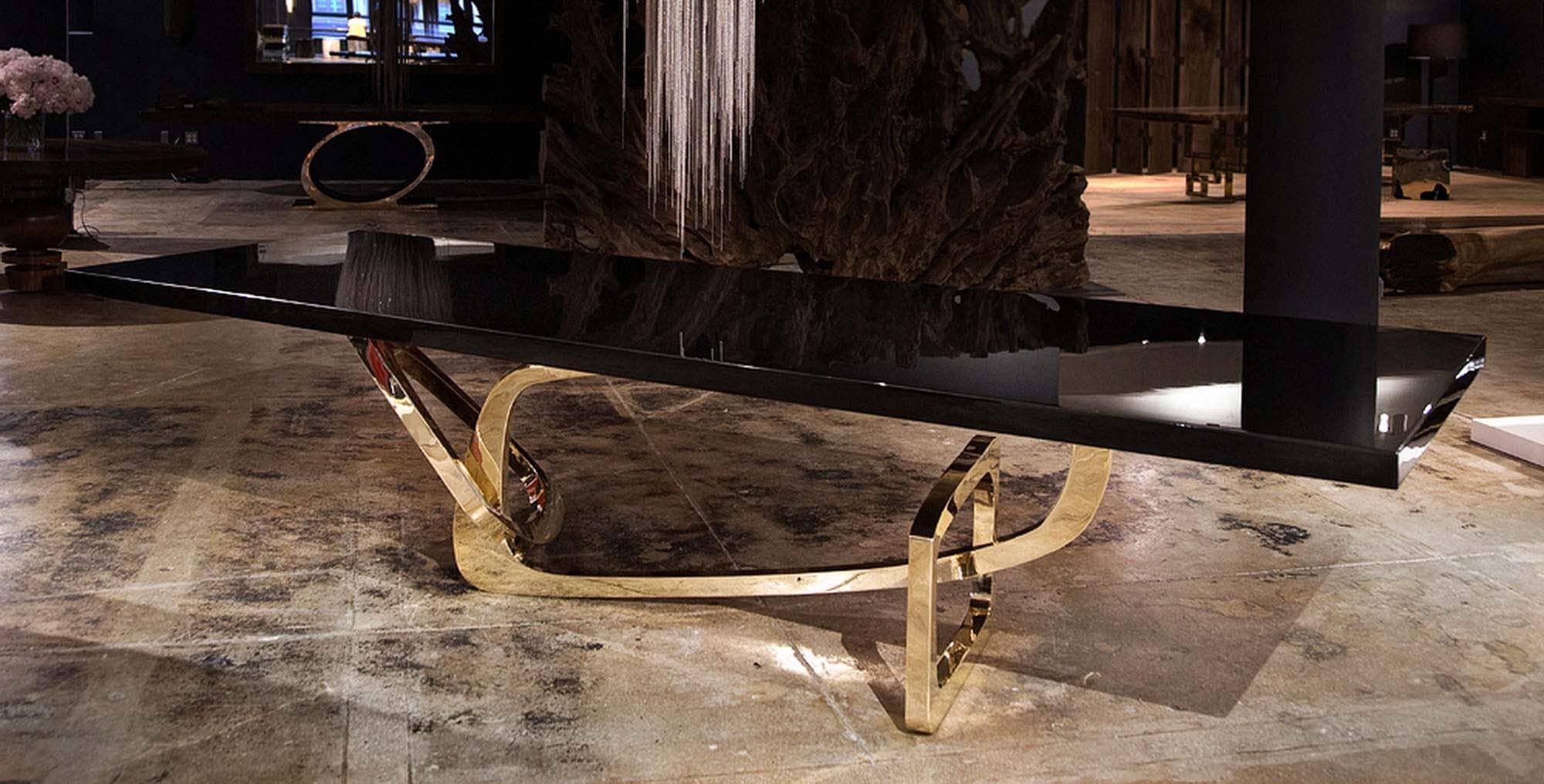 The Bangle dining table by Barlas Baylar is a contemporary interpretation of Art Deco design inspiration by utilizing rigorous craft.  The sculptural Bronze or Stainless Steel base is available in a variety of finishes.  The top can be created using