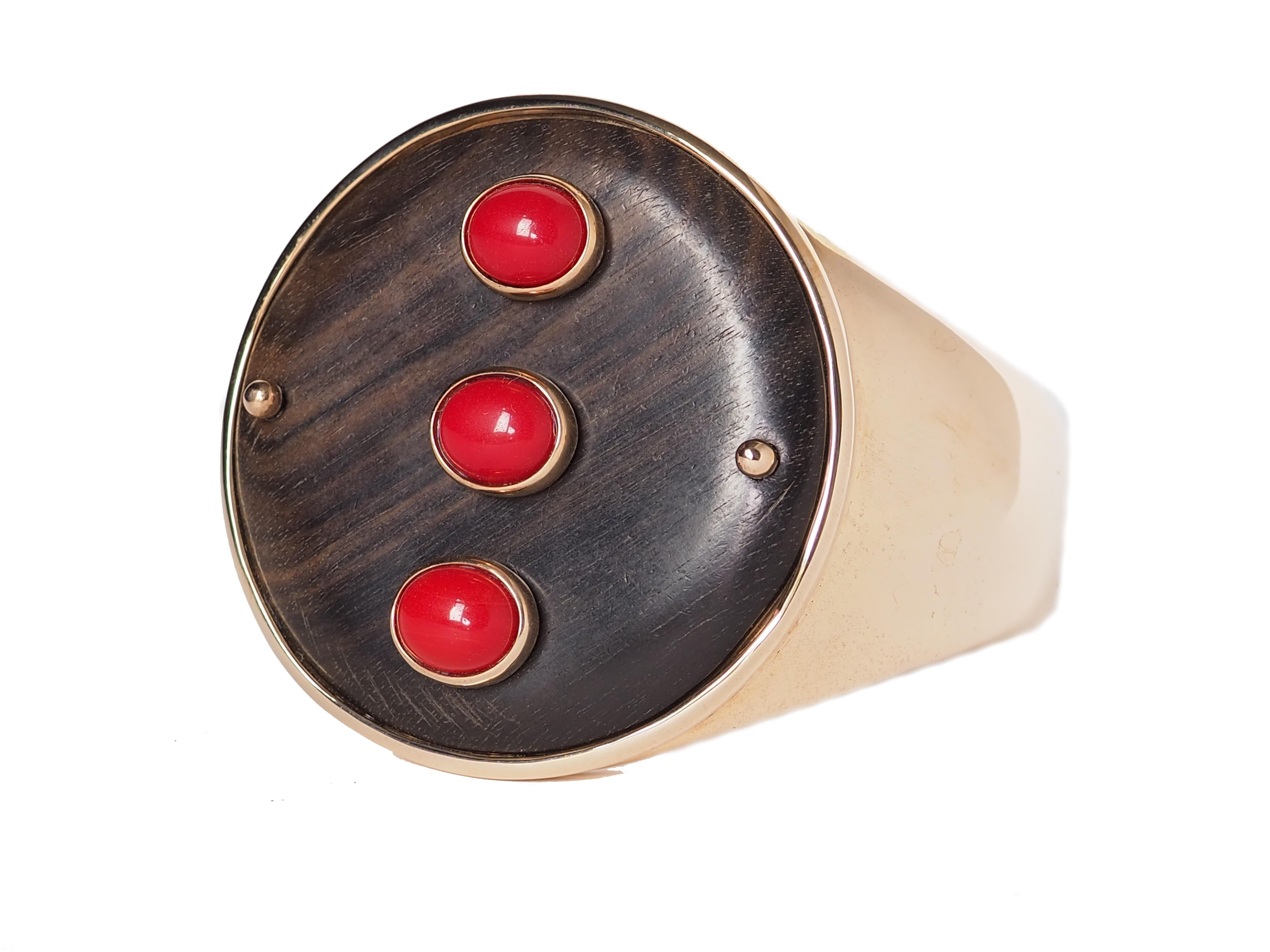 Bangle with central ebony plaque 3 coral cabochon linked in Gold 18 k gr.6,  bronze.
All Giulia Colussi jewelry is new and has never been previously owned or worn. Each item will arrive at your door beautifully gift wrapped in our boxes, put inside