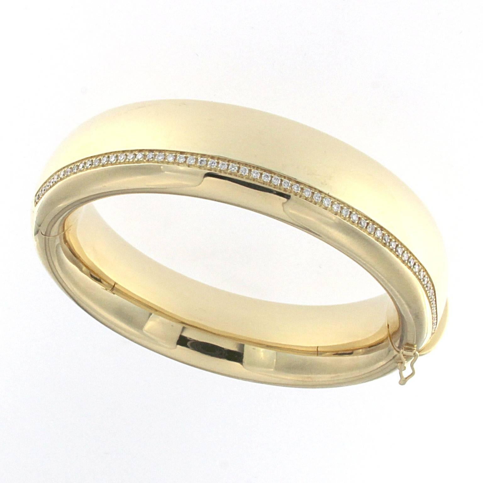Essence bangle in 18 kt  yellow gold and white diamonds 
This classic collection in Micheletto tradition

the total weight of the gold is  gr 95.70
the total weight of the white diamonds is ct 1.52 - color GH clarity VVS1

STAMP: 10 MI ITALY