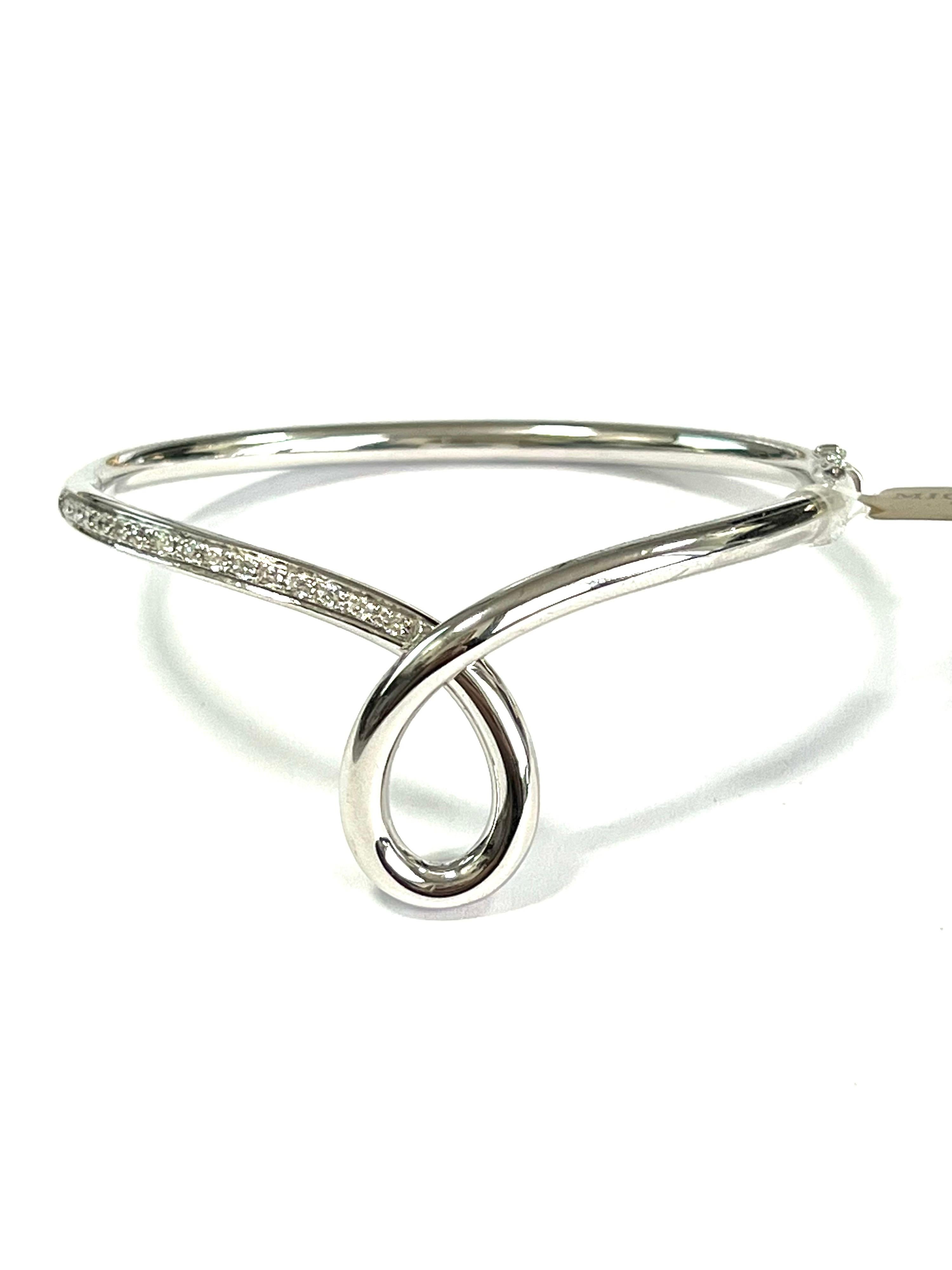 Essence bangle in 18 kt  white gold and white diamonds 
This classic collection in Micheletto tradition

the total weight of the gold is  gr 29.90
the total weight of the white diamonds is ct 0.37 - color GH clarity VVS1

STAMP: 10 MI ITALY 750

The