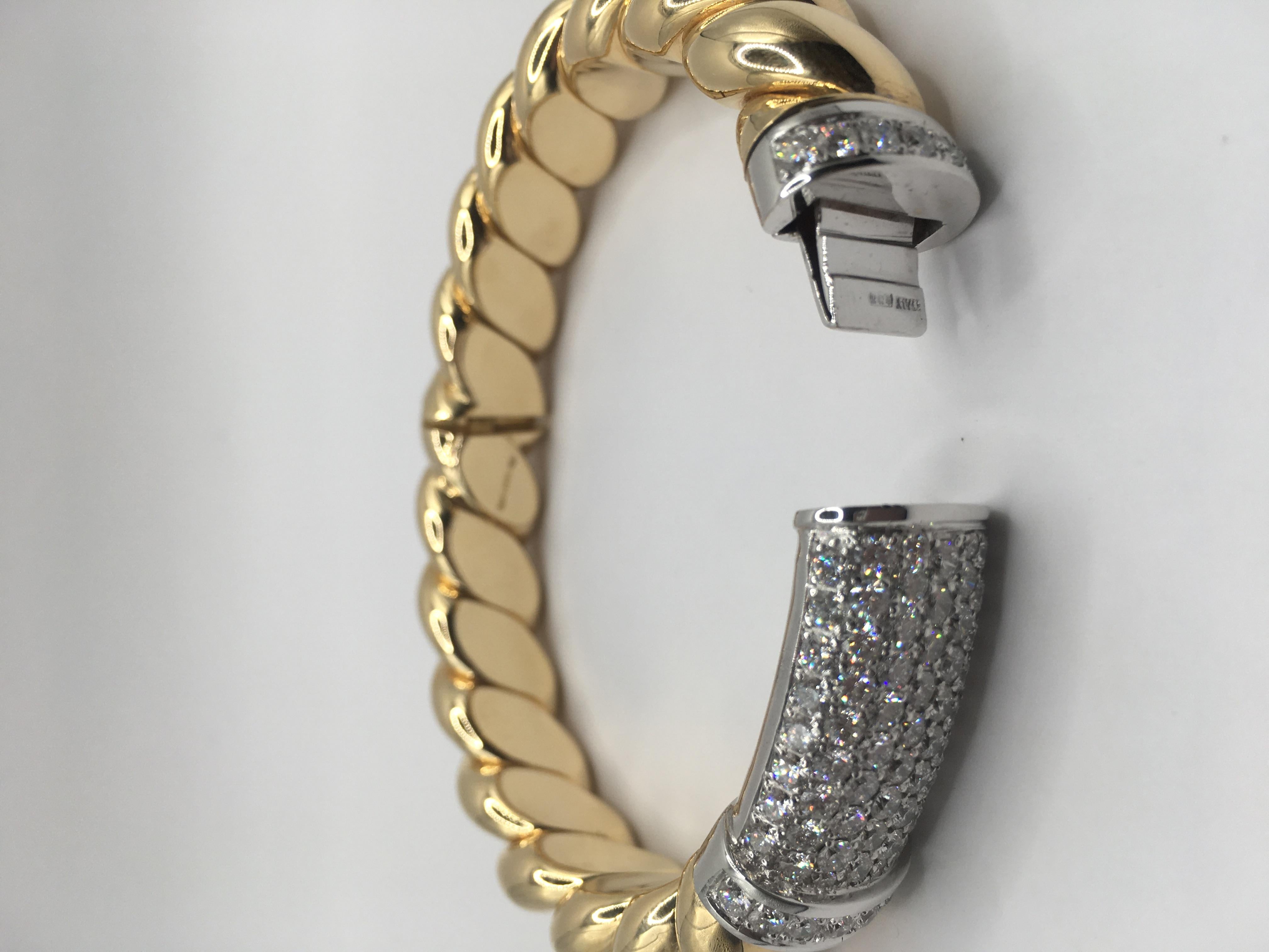 Rope bangle in 18 kt  yellow gold and white diamonds 
This is a traditional collection in Micheletto 

the total weight of the gold is  gr 65.50
the total weight of the white diamonds is ct 4.88 - color GH clarity VVS1

STAMP: 10 MI ITALY 750

The