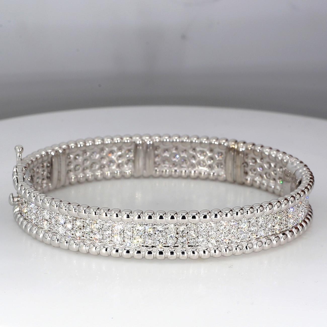 Bangle in 18K white gold with pave set round diamonds. D4.78ct.t.w.