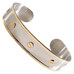 Pulsera brazalete Love de acero inoxidable y oro amarillo de 18 quilates