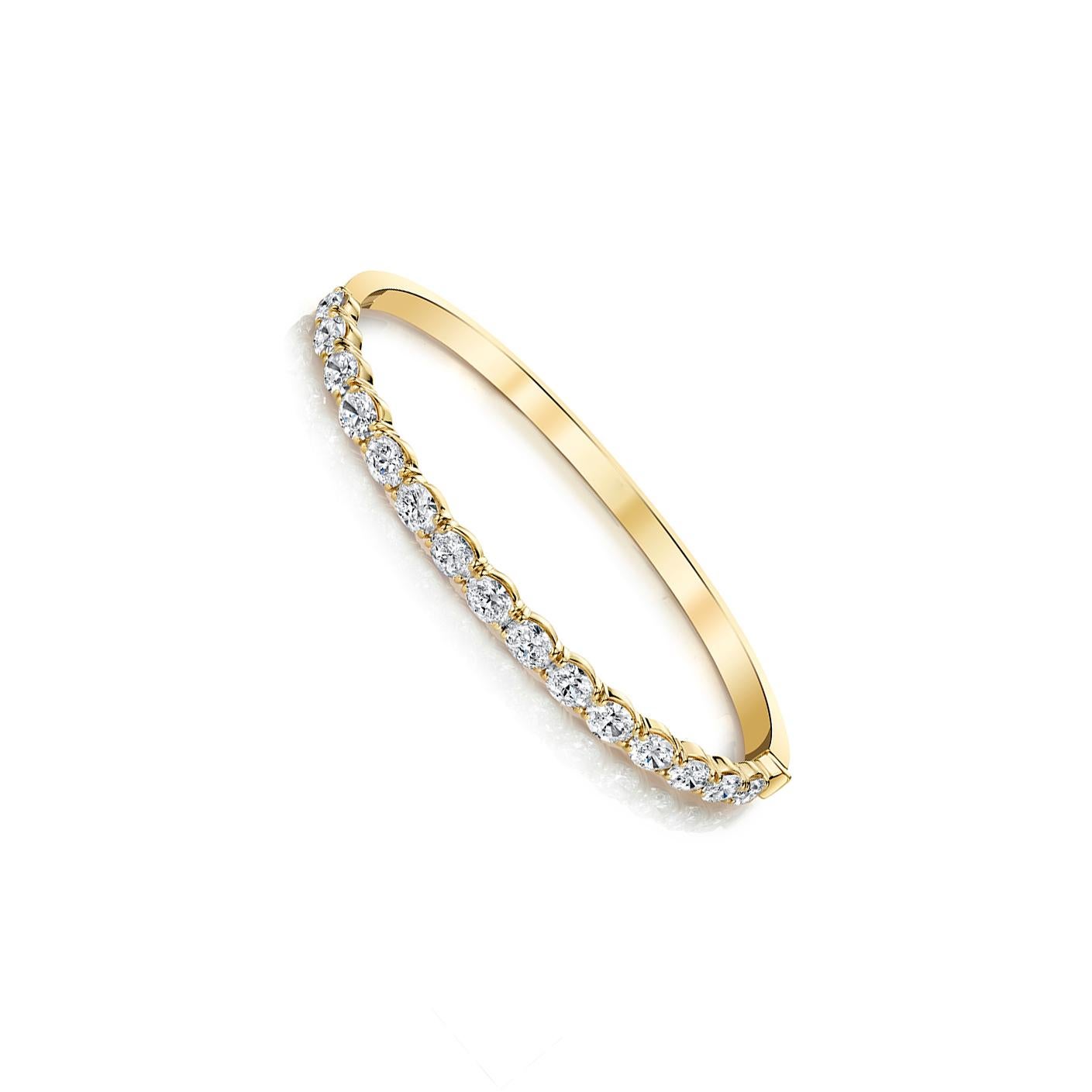 15 Oval-cut diamonds set in 18k yellow gold 4-prong bangle bracelet. 
Carat total weight 4.64 
GIA Color D-F Clarity VVS1-VS2 
Also available in 18k rose and white gold.