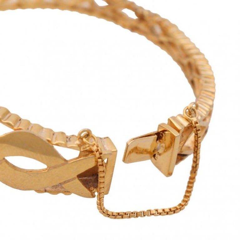 Bangle with Emerald-Encrusted Opening Capsule Top For Sale at 1stDibs