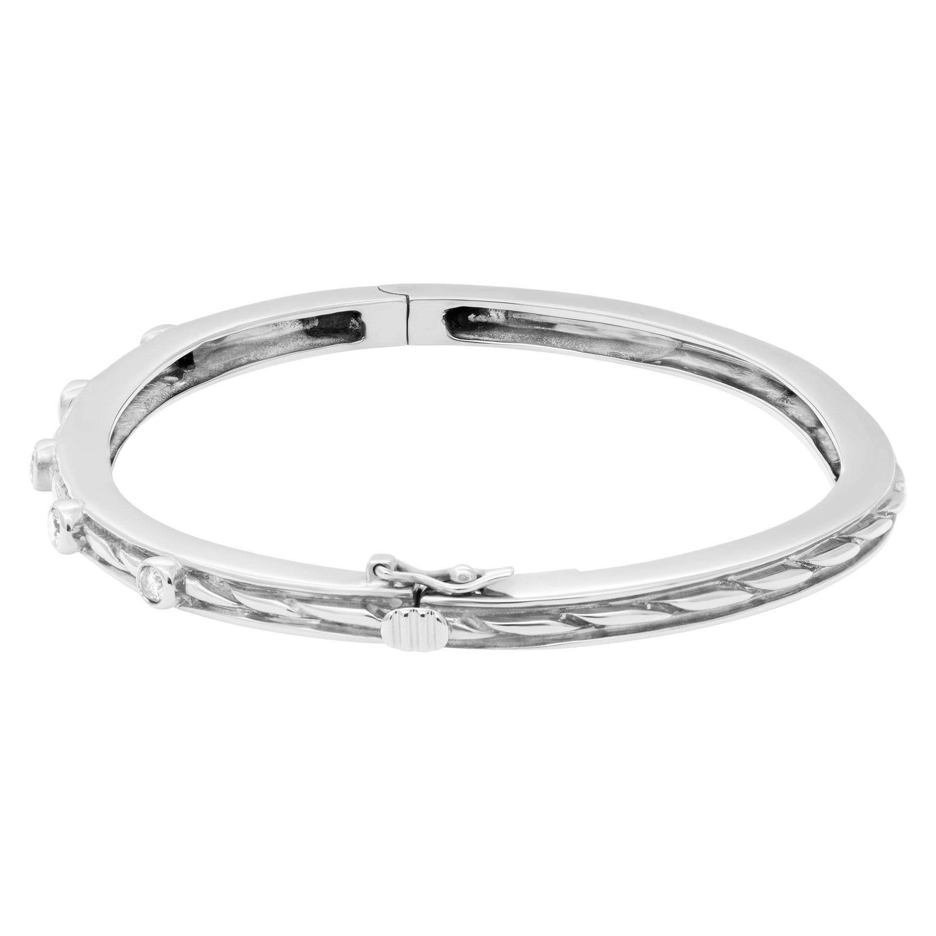 Beautiful bangle with five diamonds total 0.50 carats set in 14k white gold. Fits 6.5-7 inches wrist. Width 3.5mm.
