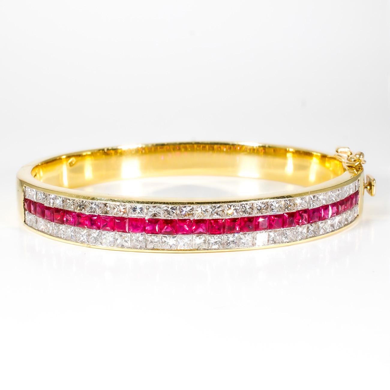 Bangle in 18K yellow gold with 3-row invisible set combination princess cut diamonds and rubies.  D4.02ct.t.w.  Rubies 2.76ct.t.w.