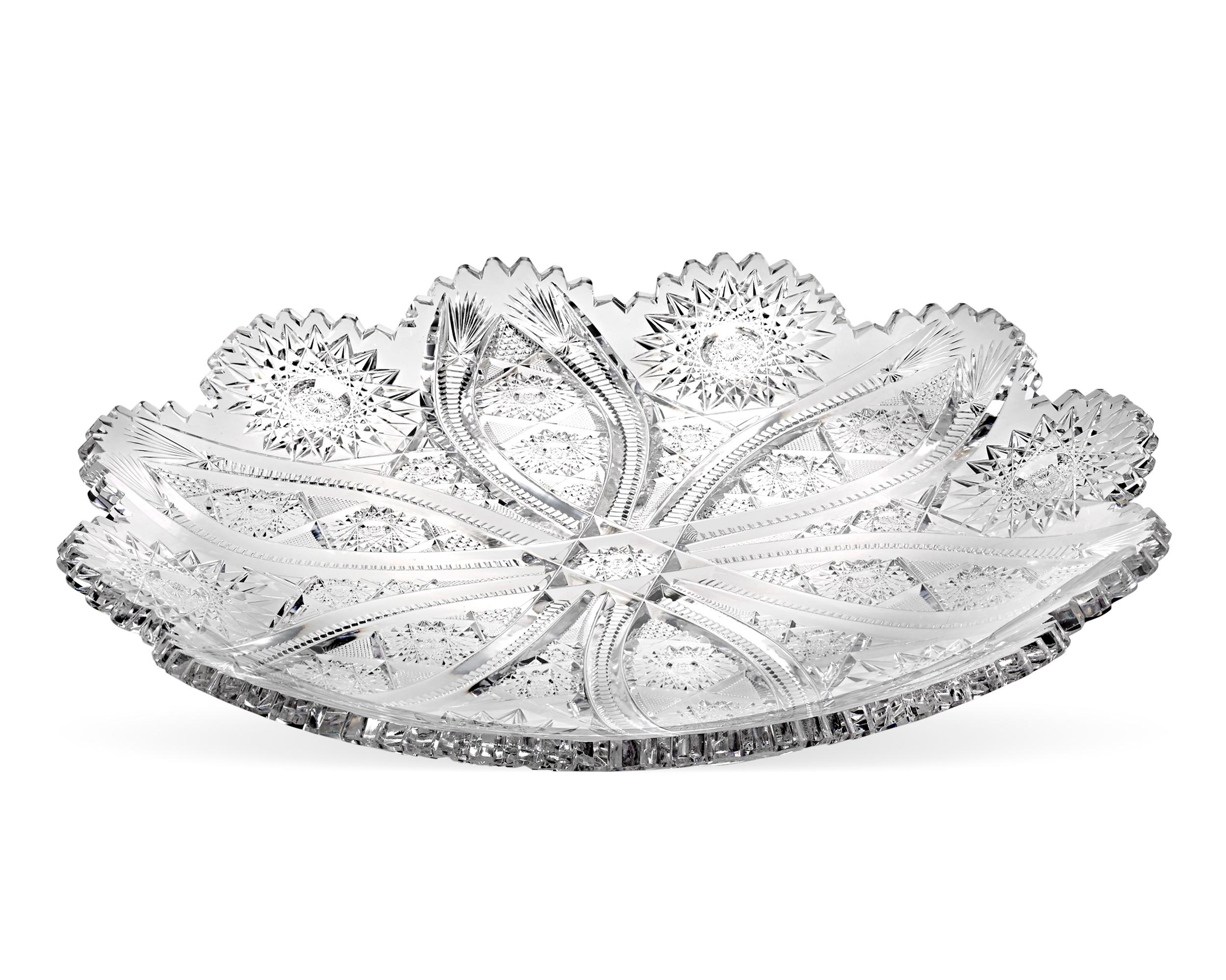 The Bangor pattern adorns this American Brilliant Period cut glass bowl by the Jewel Cut Glass Company. Cut with a high level of precision, the pattern features a richly detailed hobnail, vesica and prism motif so striking and complex in its