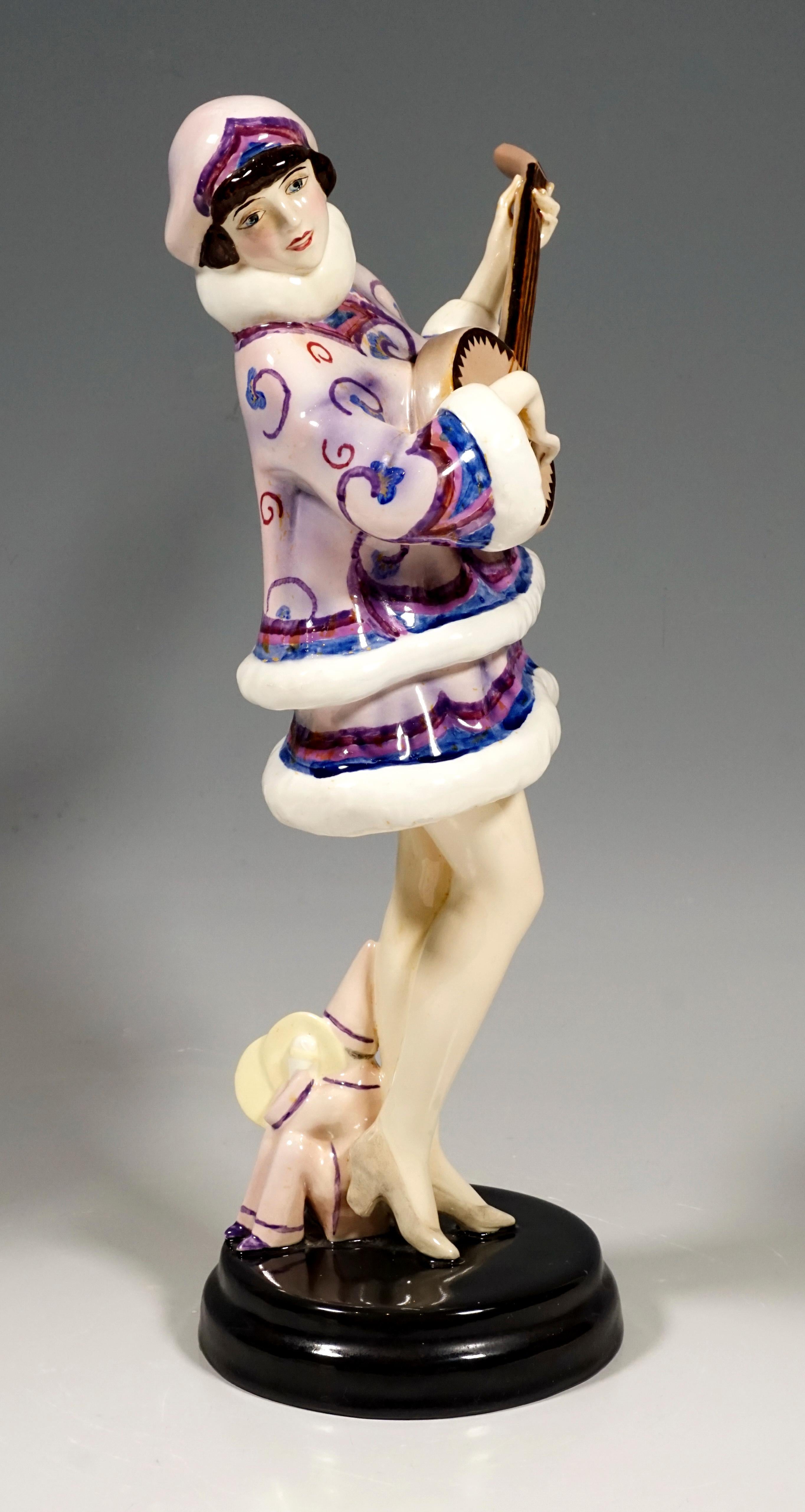 Very rare Art Deco Goldscheider art ceramic figurine around 1930.
Shown is Zerline Balten, a Viennese dancer and actress who accompanies herself on a banjo in her 'fantasy dance'. The young lady wears a winter costume, sweater and skirt in delicate
