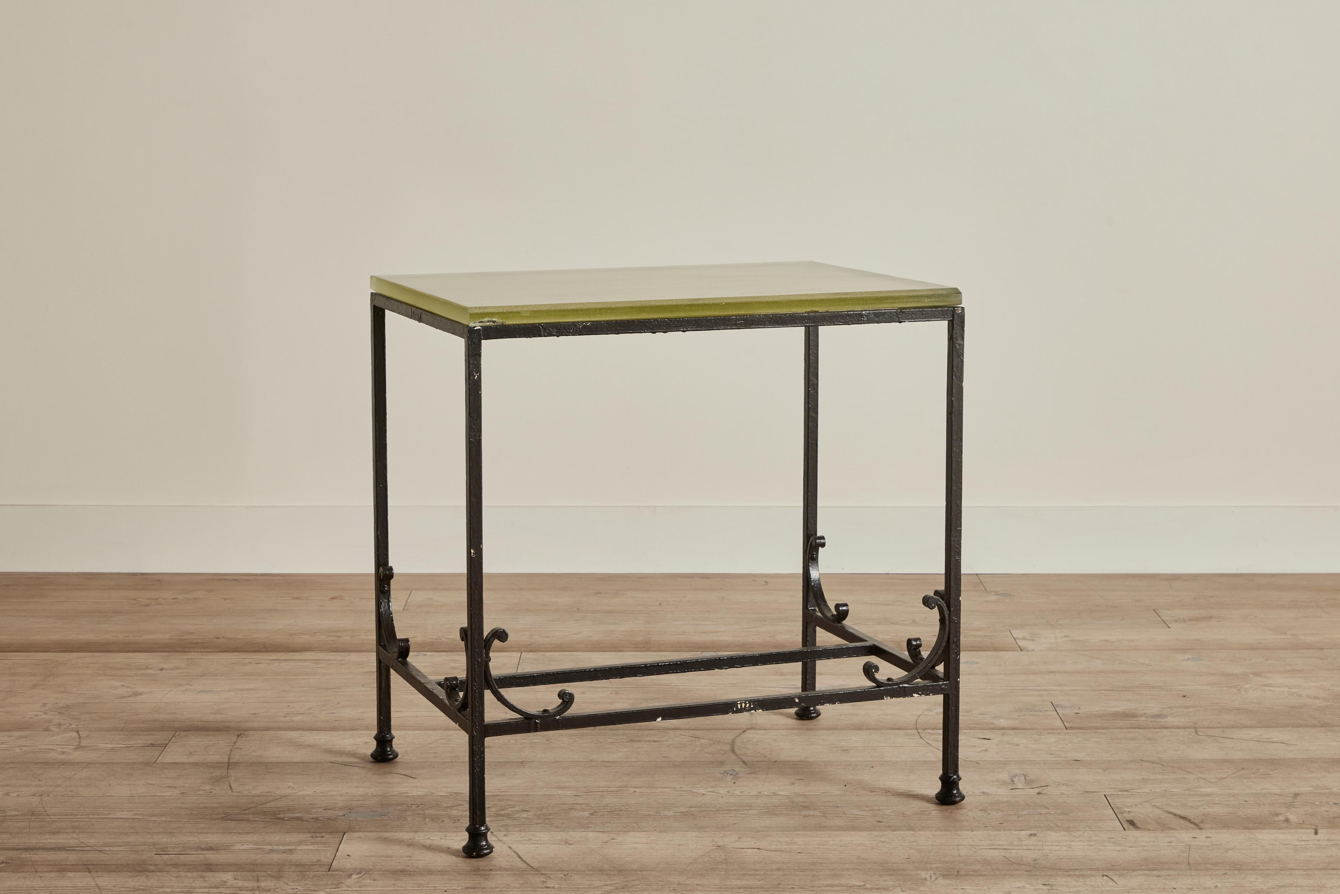 Early 20th century bank side table made from thick glass and wrought iron. Wear throughout on iron and glass that is consistent with age and use.