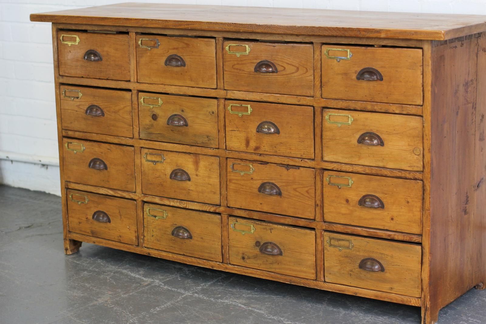 Bank of 19th century pine Haberdashery drawers.

- 16 identical drawers
- Hand cut dovetail joints
- French, Circa 1880s
- Measures: 150cm long x 50cm deep x 84cm tall
- Each drawer measures 27cm wide x 38cm deep x 13cm tall.

Condition