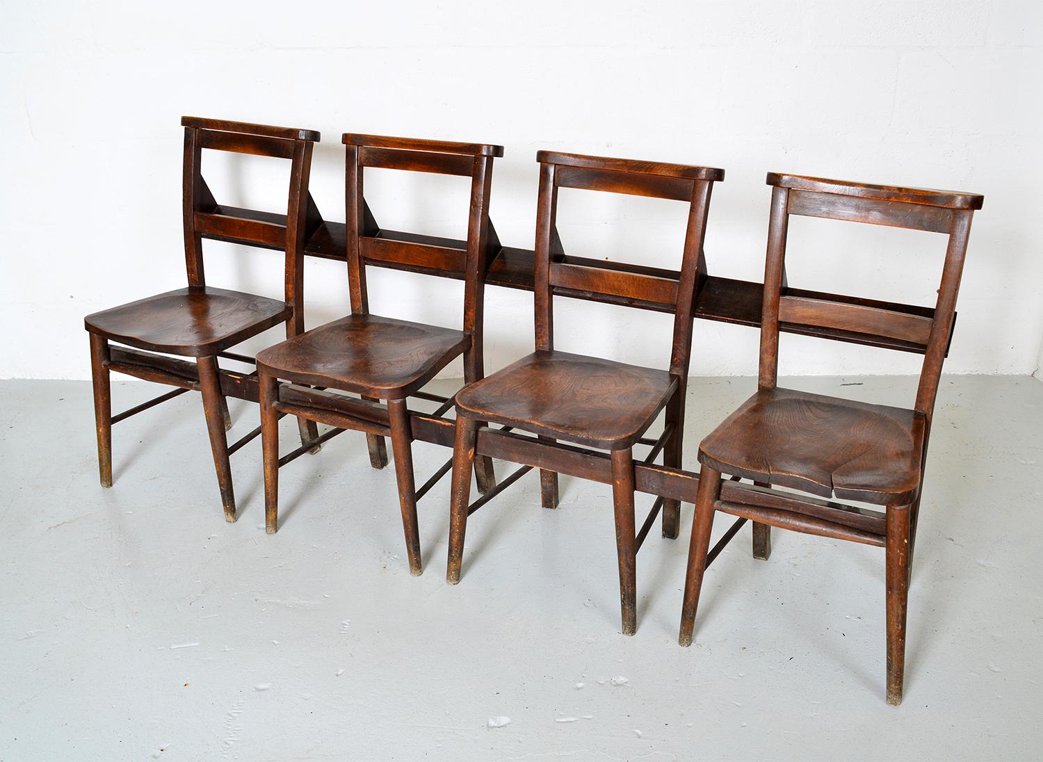 Bank of Estate made, Country House boot room chairs. The 4 Chapel chairs were once repurposed by the Estate carpenter into a bank of chairs / bench, which was used in the boot room of a Country House in Dorset. 
The shelves at the back would once