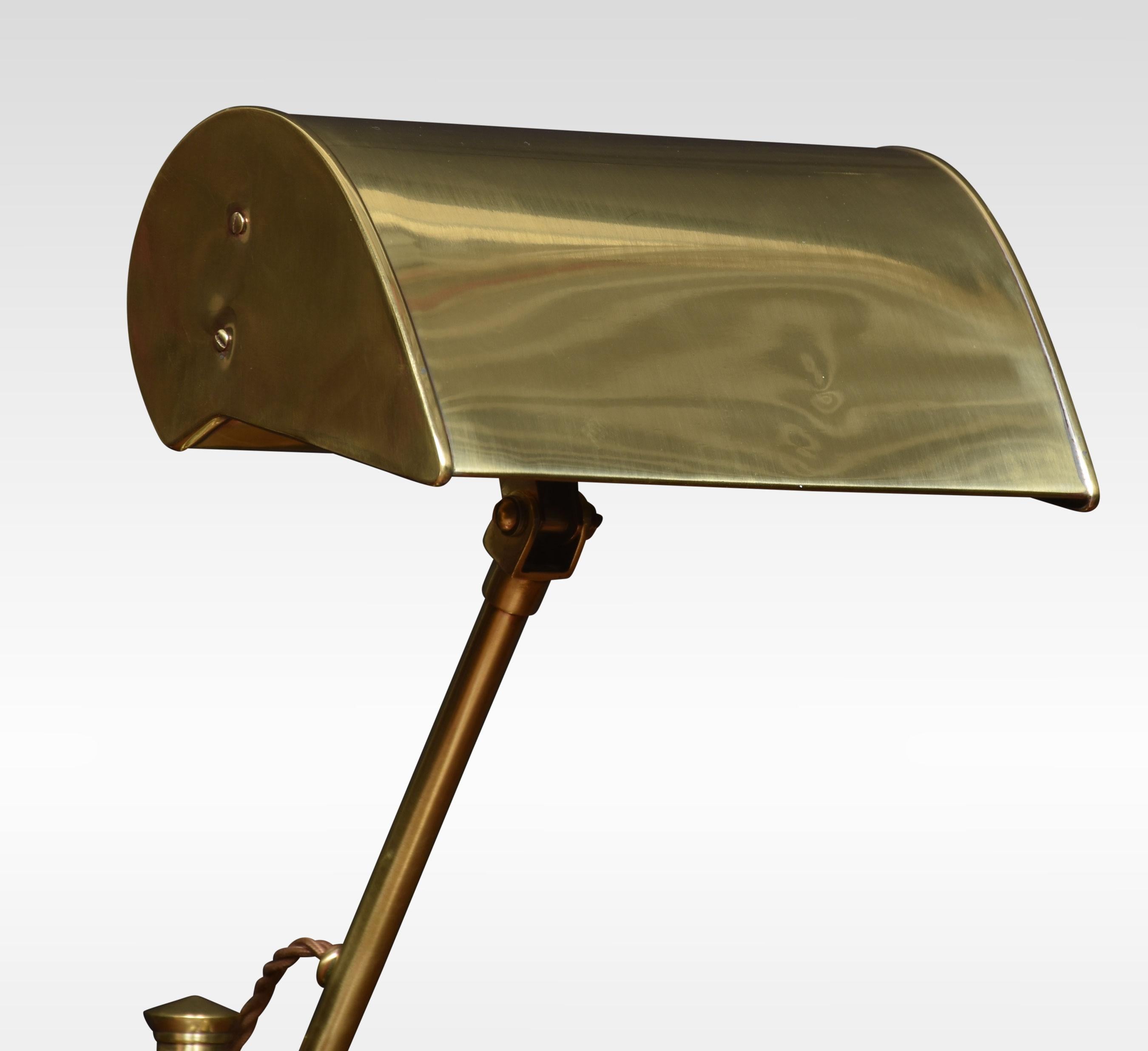 Bankers brass desk lamp, the shaped brass base, and pivoted sweeping arm supporting adjustable lampshade. The lamp has been rewired.
Dimensions
Height 18 Inches
Width 8.5 Inches
Depth 8 Inches.