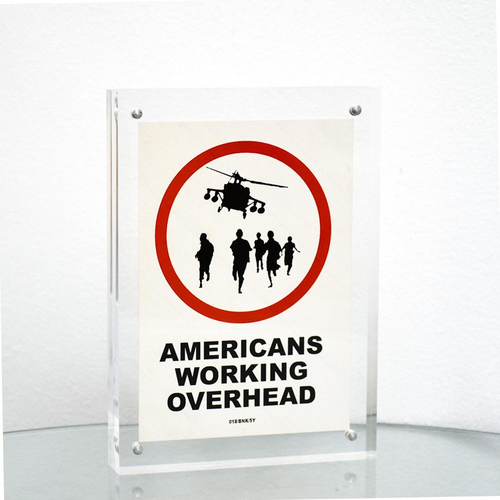 BANKSY Americans Working Overhead 018/BNK/5Y Sticker (gerahmt) – Print von Banksy
