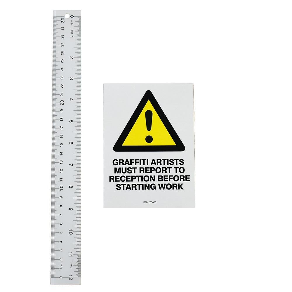 Clever Banksy Sticker. Graffiti Artists Must Report To Reception Before Starting Work.
Printed with “BNK/5Y 020” on bottom of sticker. That is the item number for the sticker.
Banksy used number designations in a lot of his street stickers to
