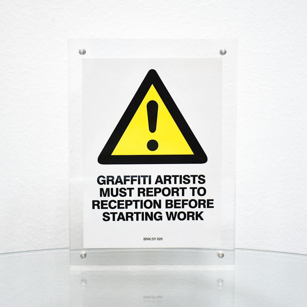 Graffiti Artists Must Report to Reception BNK/5Y/020 Sticker (Framed) - Print by Banksy