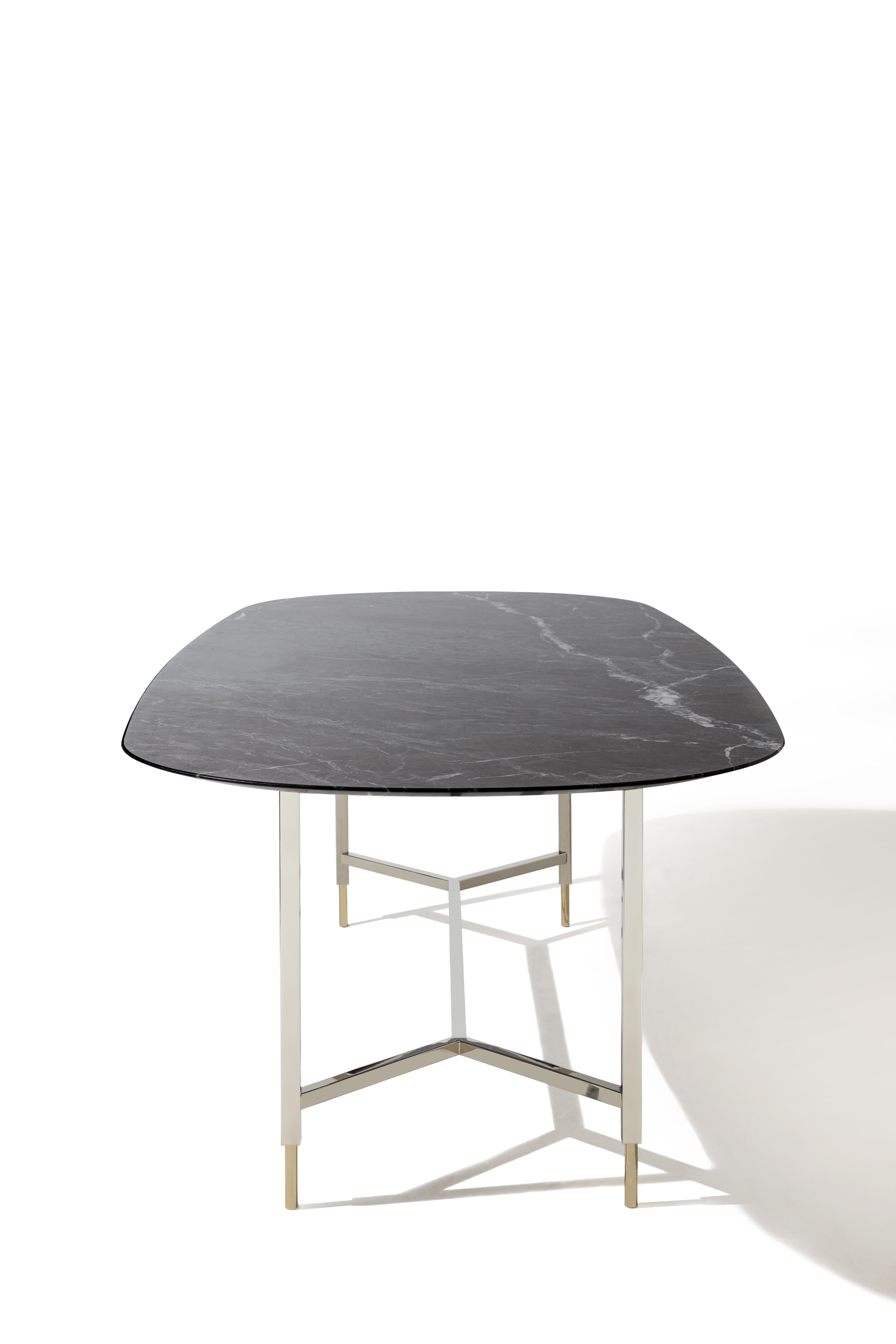 Banquet is a sculptural table that fits into the home in a delicate and elegant way.
Square tubular metal structure, polished nickel finish, glossy gold round section.
The designer Sam Baron said about it: