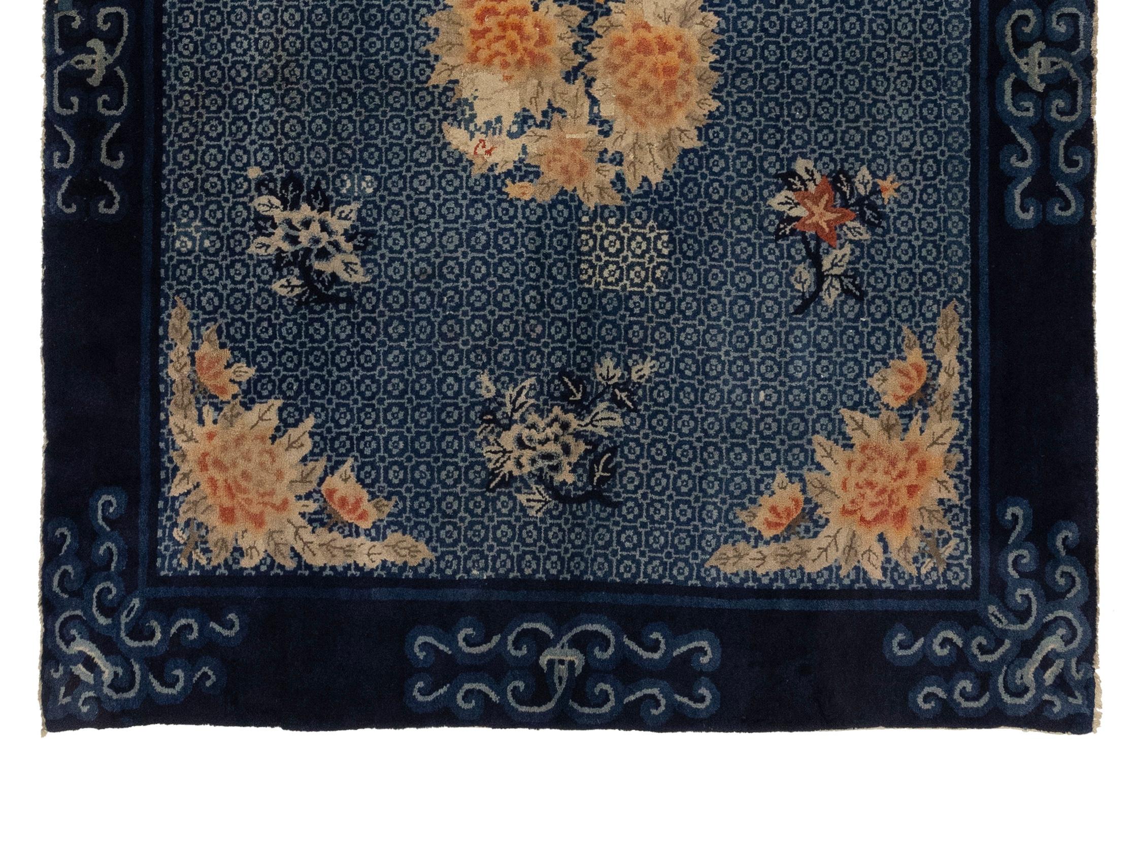 This carpet was woven in the city of Baotou, in what is now Inner Mongolia. The rugs produced in this region were known for their dense, plush pile, and the pictorial ones were particularly coveted. Images were chosen for a symbolic as well as