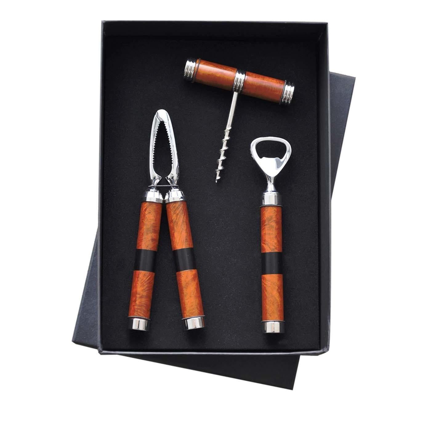 Part of a collection of entertaining accessories inspired by Art Deco, this set of bar accessories by Nino Basso features handles in durable briar root, accented with small strips of ebony. The set includes a corkscrew, beer bottle opener and