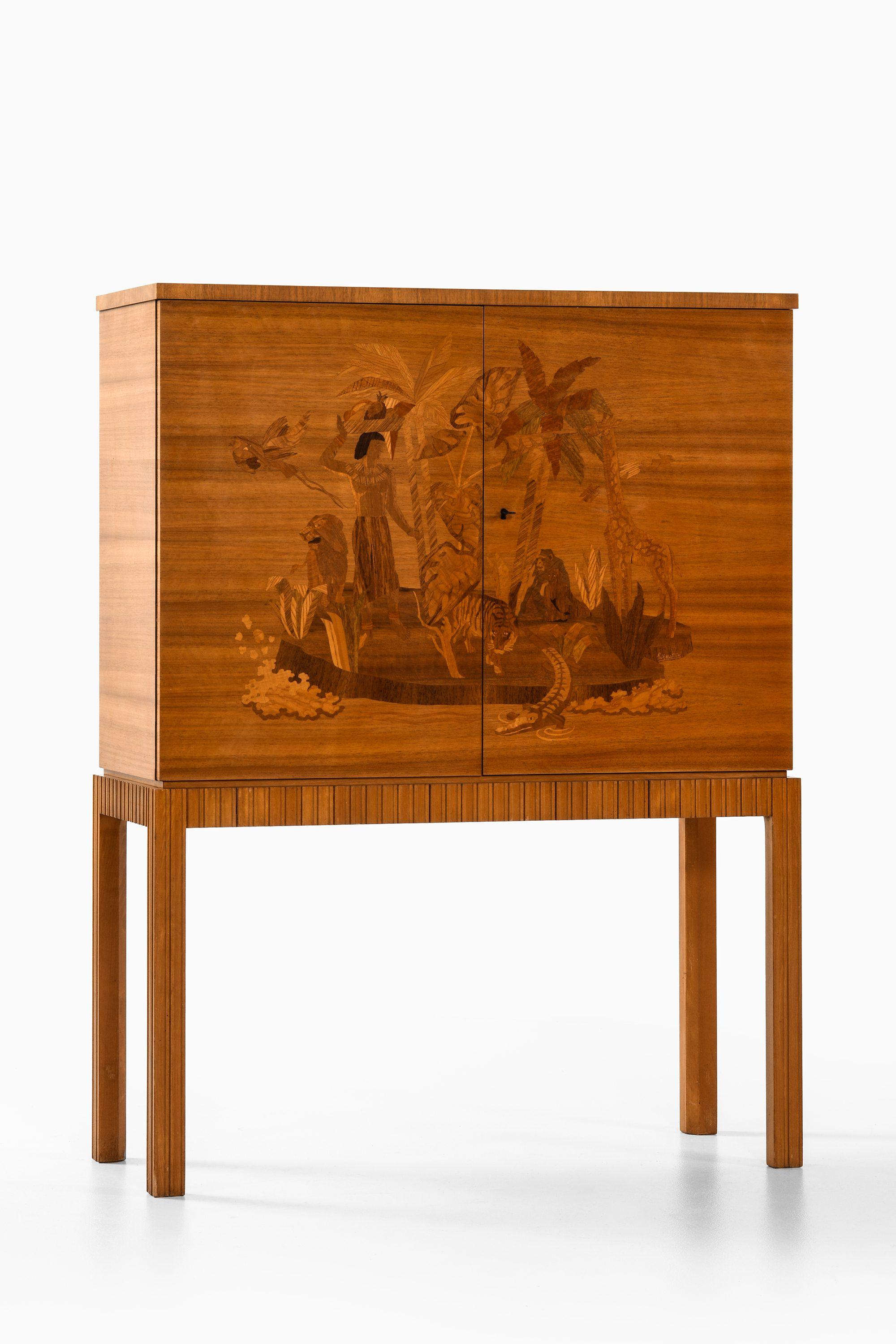 Bar Cabinet by Erik Matsson, 1950's

Additional Information:
Style: Mid century, Scandinavia
Produced by Mjölby Intarsia in Sweden
Dimensions (W x D x H): 101.5 x 40.5 x 134.5 cm