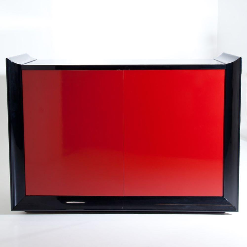 Bar cabinet by Gio Frigerio. Red lacquer doors and mirrored interior.
Makers label affixed to back.