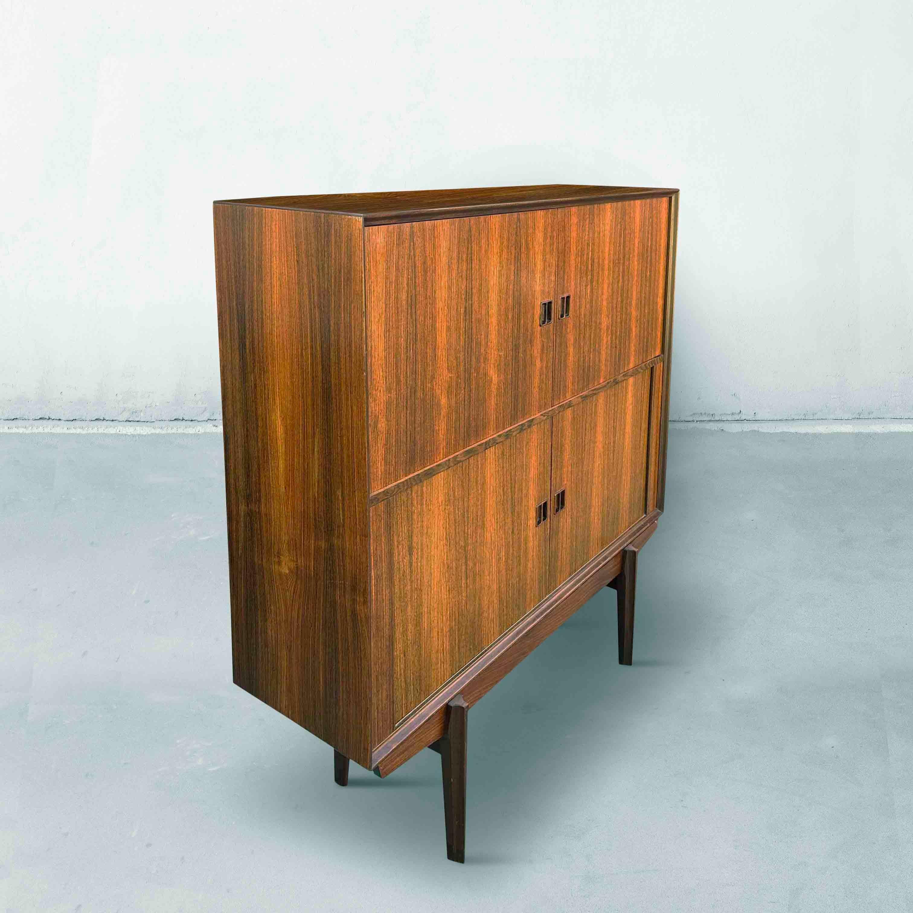 A beautiful bar cabinet by Oswald Vermaercke for V-Form from the 1960s. This sideboard has two regular doors at the top and two sliding doors (or tambour doors) at the bottom. In very good condition, with normal signs of use. See photos. The wiring