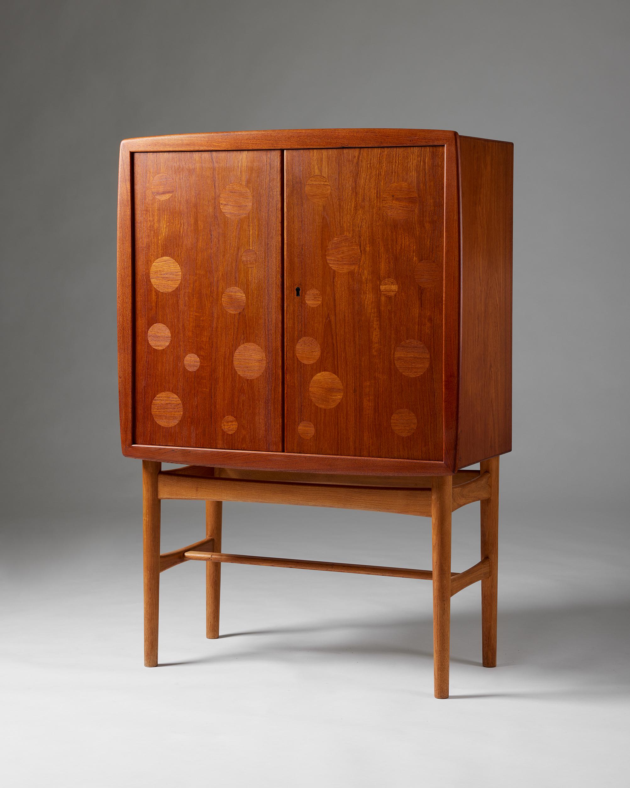 Bar cabinet designed by Kurt Östervig for KP Möbler,
Denmark, 1950s

Teak, maple, and glass.