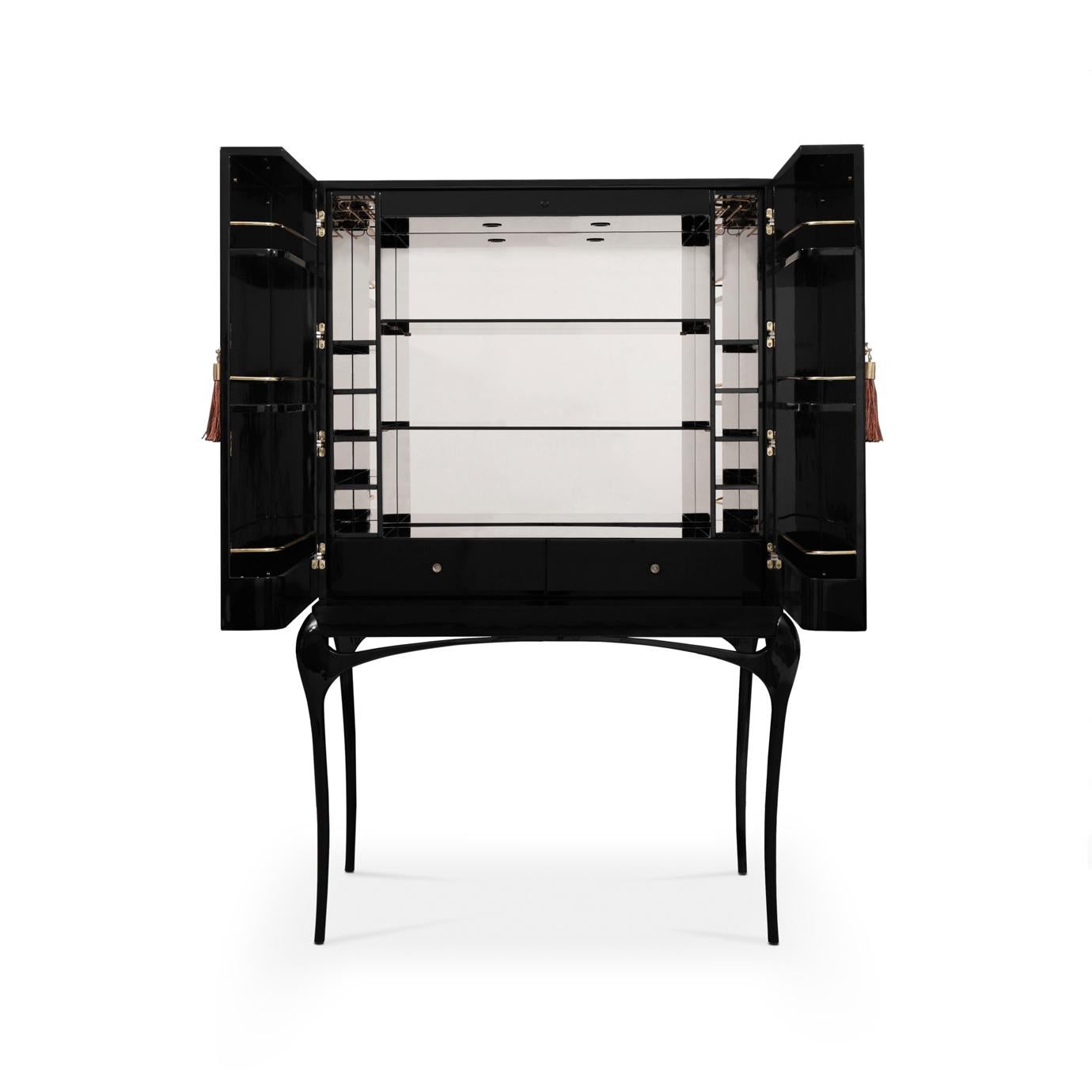 Enticing admirers with its exotic feather doors and sexy curved lacquered legs, the Temptation Bar Cabinet will steal cocktail hour. The chic black and gold interior is perfectly designed to store your wine and cocktail accouterments. Open or closed