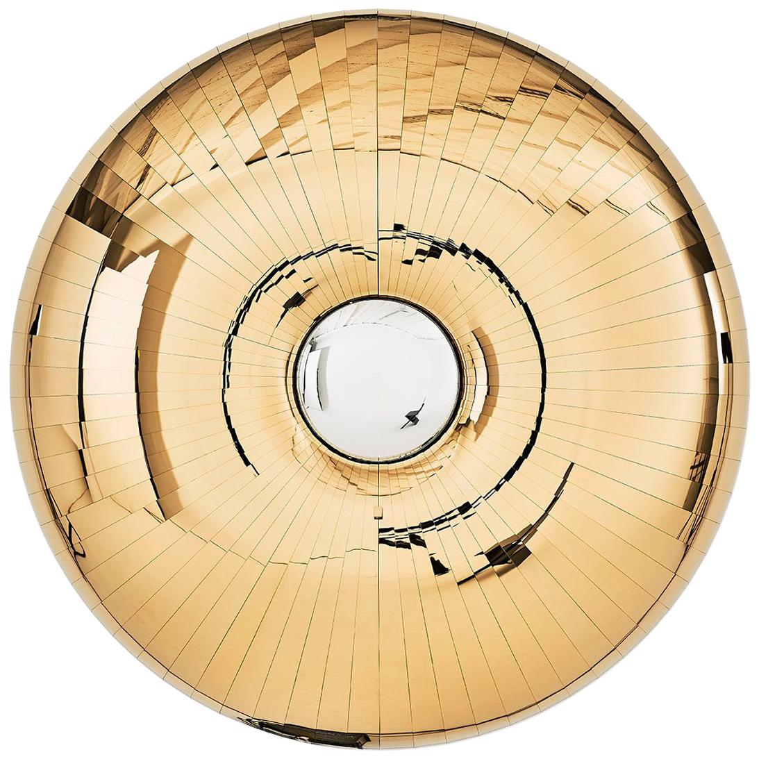 The bilateral symmetry of an urchin shell provided a creative influence as well as a technical one for this large wall-mounted bar cabinet. The seventy polished brass panels on the doors are curved and faceted to create fragmented reflections of the