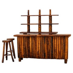 bar cabinet is handcrafted in solid walnut and oak