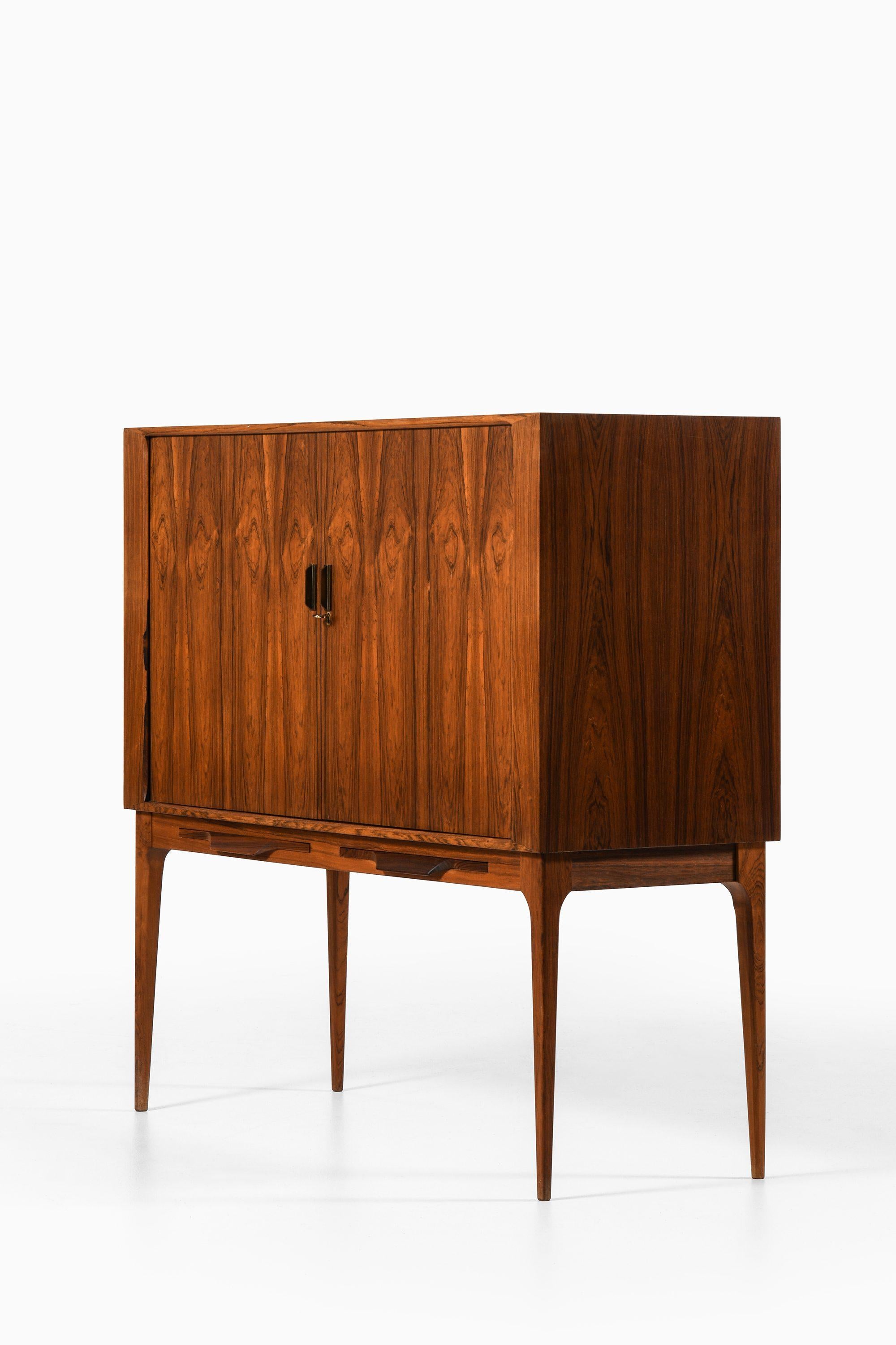 Scandinavian Modern Bar Cabinet with Tambour Doors in Rosewood and Brass by Kurt Østervig, 1960's For Sale