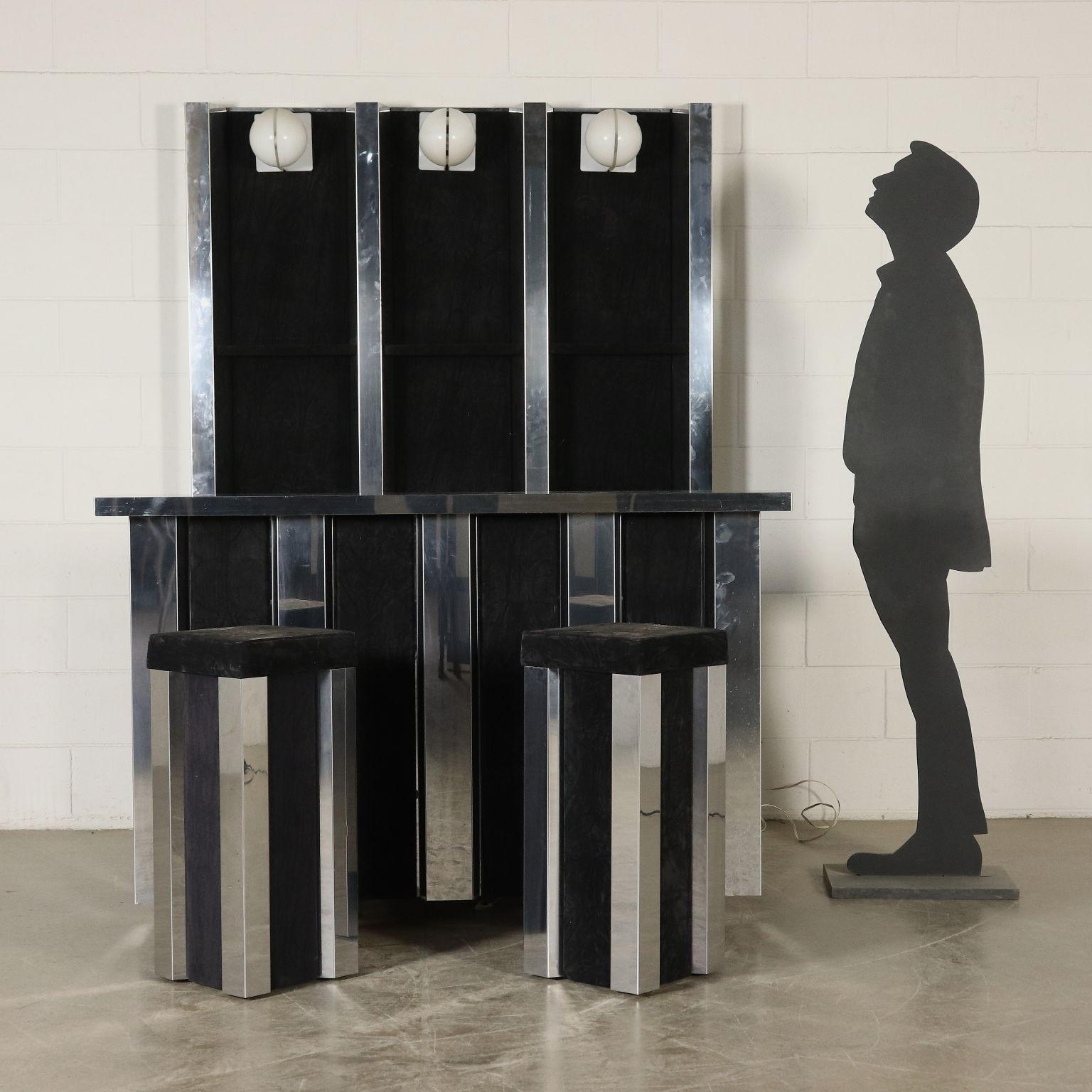 A bar cabinet with panel at the bottom, counter with fridge, compartment for bottles and pair of stools. Wood covered with fabric, chromed metal. Manufactured in Italy, 1970s.