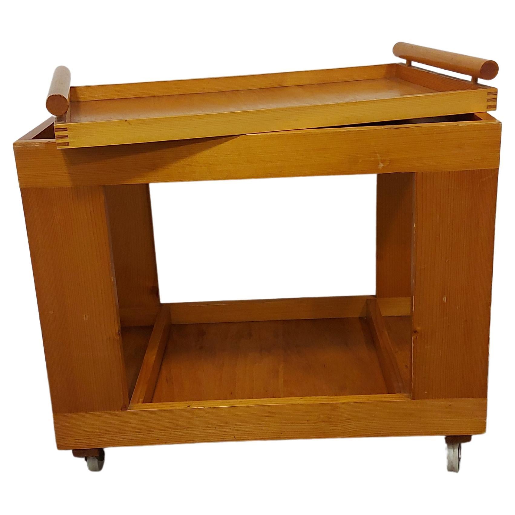 Bar Cart 1970s - solid wood

Part of the cart is also an integrated tray, which, placed on top of the cart, represents an integral part of the cart.
Cart has wheels that rotate in all directions and allows smooth movement.

Two tiered for