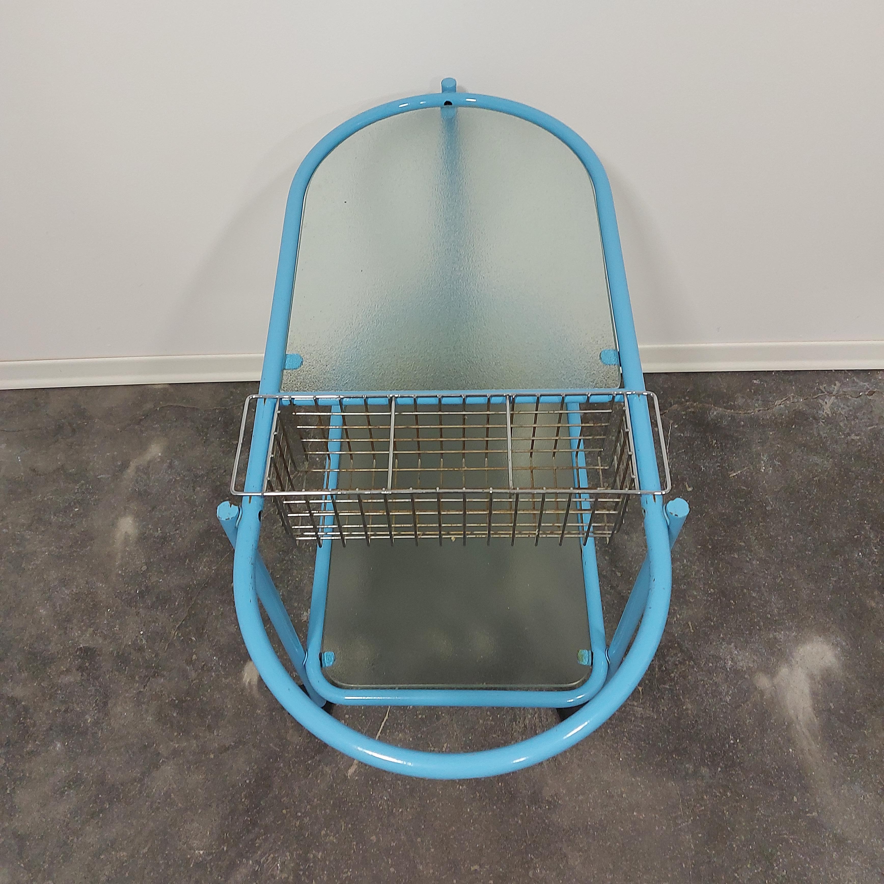 Bar cart 1970s

Really nice serving bar cart in blue colour.

H - 26 cm - down shelf, 66 cm - upper shelf
W - 88,50 cm
D - 43,50 cm