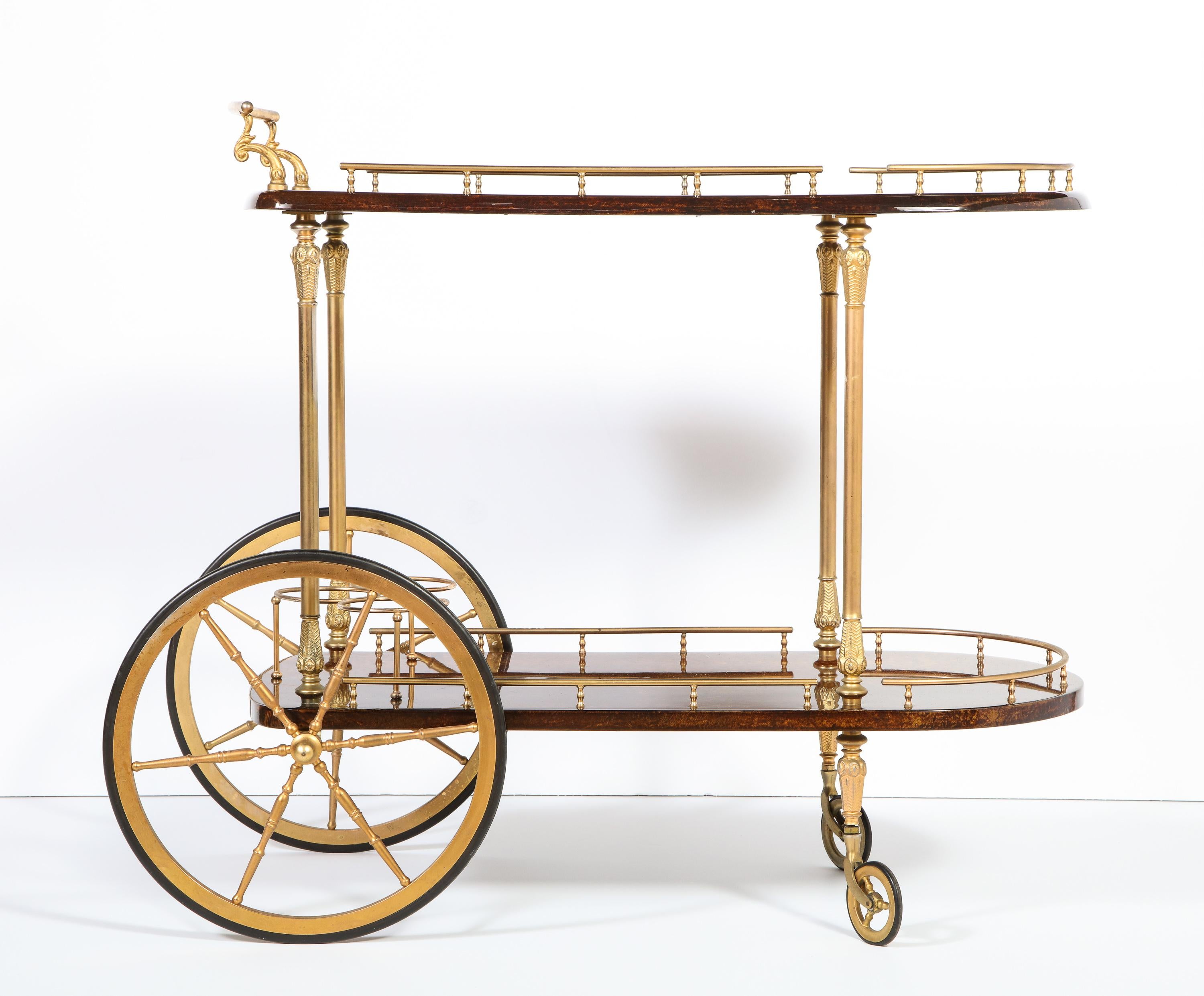 Decorative Aldo Tura lacquered goatskin parchment two level bar cart trolley with brass detailing, Italy, circa 1950. Chocolate color.