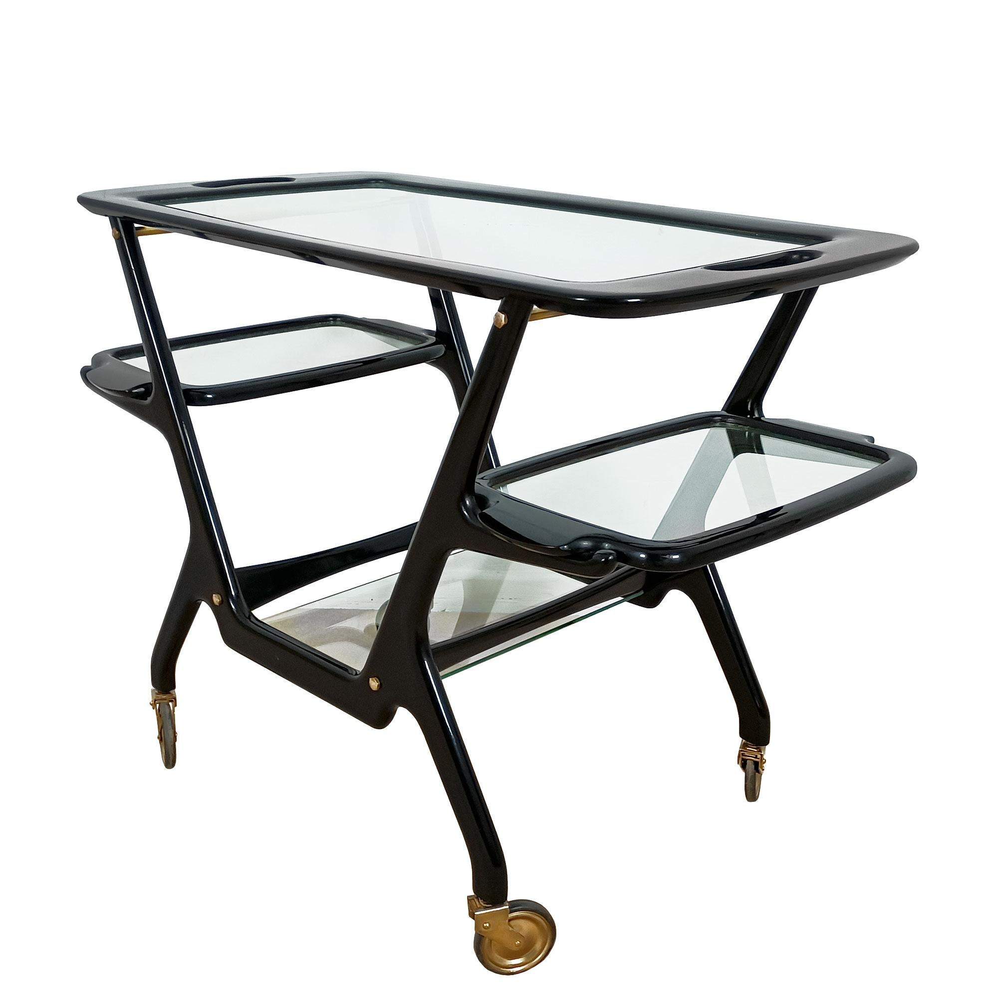Bar cart in stained and french polished beech, glass and polished brass, with three removable trays. Can be completely dismantled.

Design: Cesare Lacca
Manufacturer: Cassina

Italy, circa 1948-50.