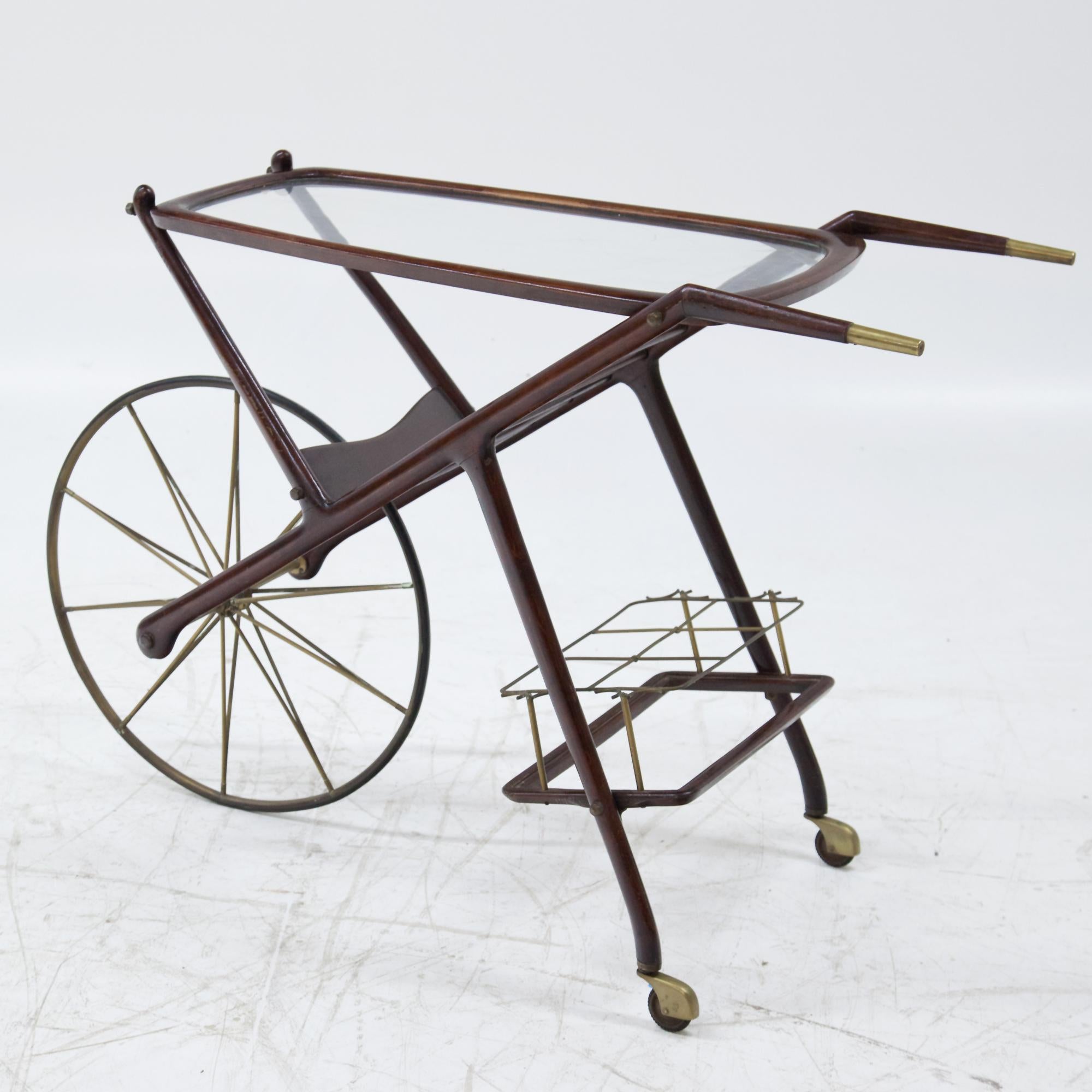 Carello by Italian designer Cesare Lacca with thin wheel, space for six bottles and a glass shelf.