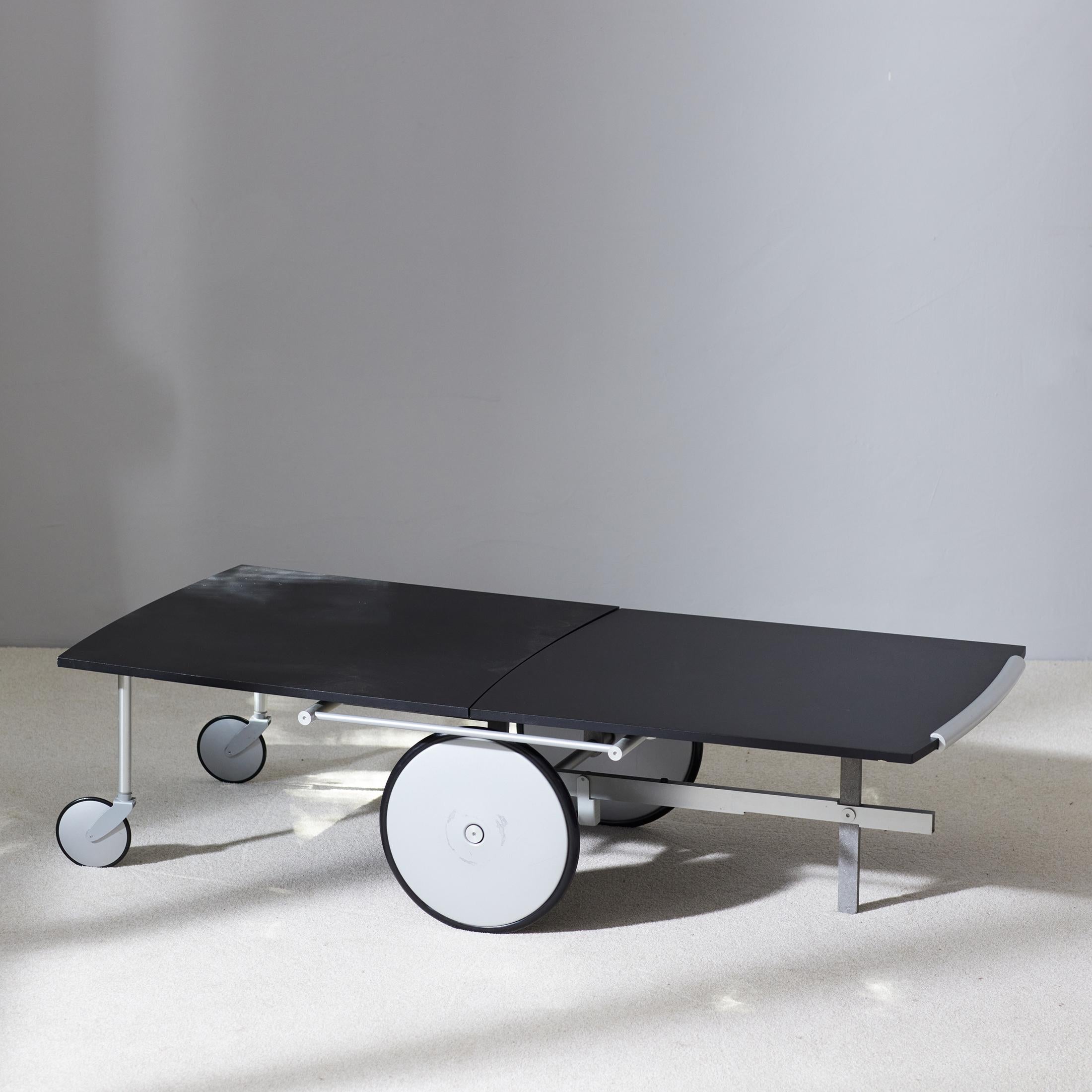 Raul Barbieri and Giorgio Marianelli are Italian industrial designers and architects. They have worked together for many years and created elegant and funcional pieces such as this unique Convertible Trolley / Coffee Table for Ycami from 1990.
The