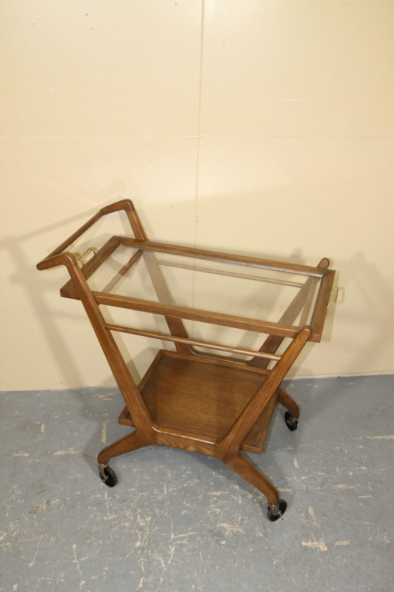 1950s Oak bar cart/tea trolley by Cesare Lacca for Cassina. This refinished cart has a removal top tray. Original wheels roll freely. I great simple cart that will look nice in any setting.